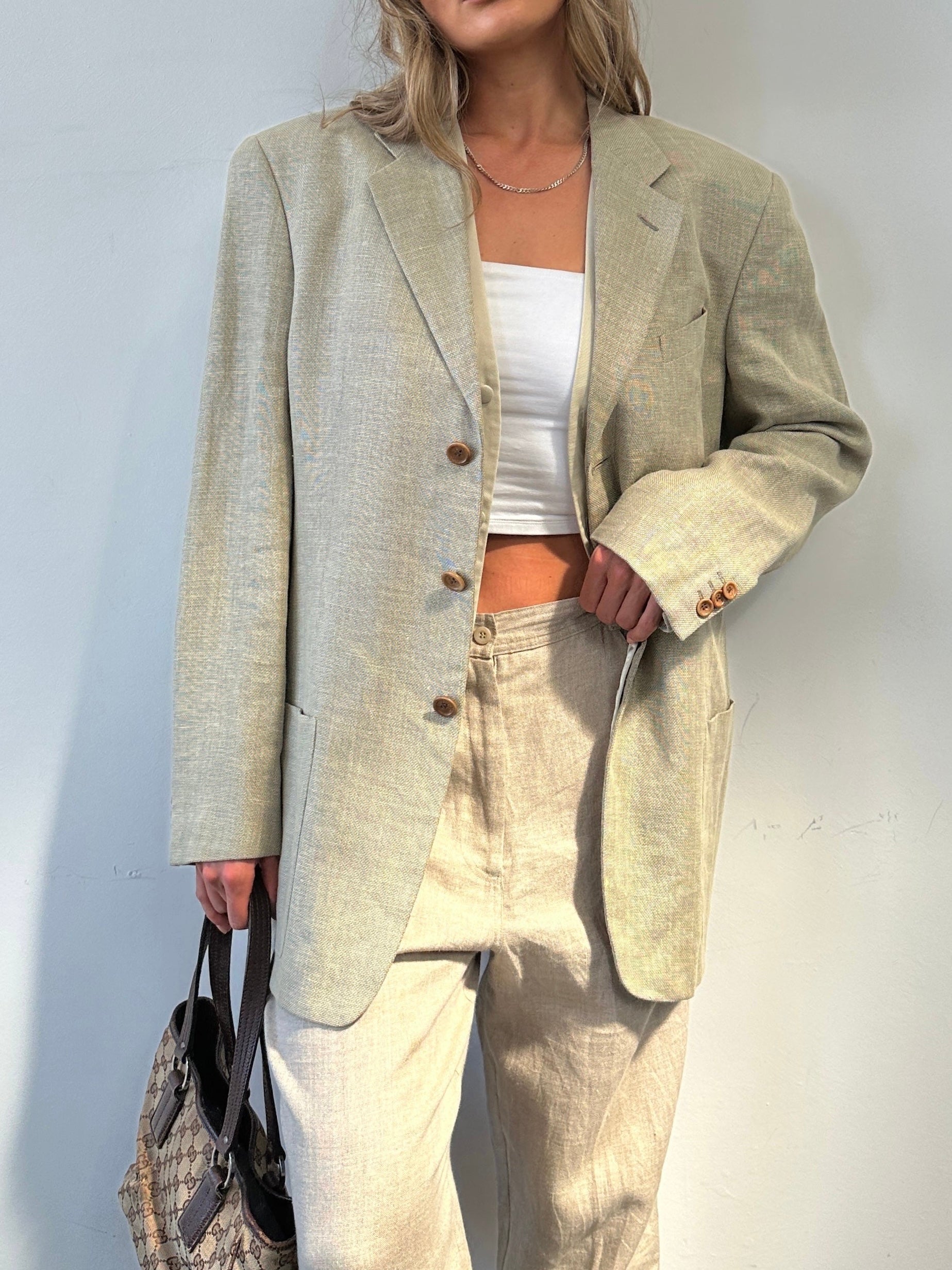 Armani Collezioni linen wool single-breasted blazer in size 42R/L, shown on a hanger with visible lapels and tailored fit.