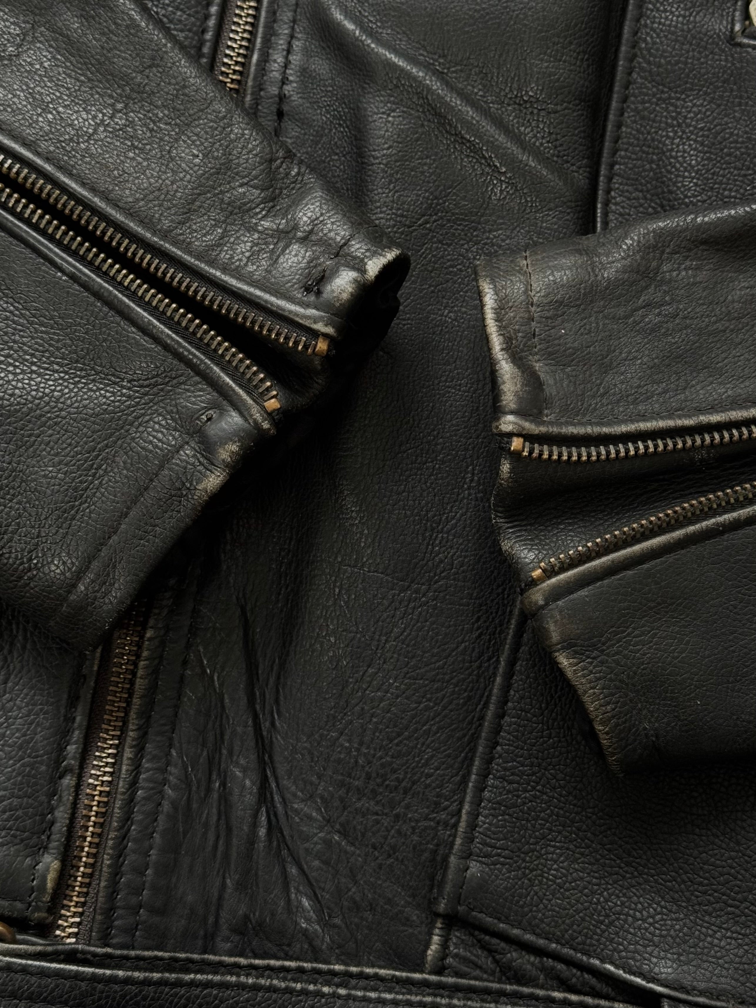 Vintage 1990s leather biker jacket in size M/L, featuring classic distressed leather and rugged style.