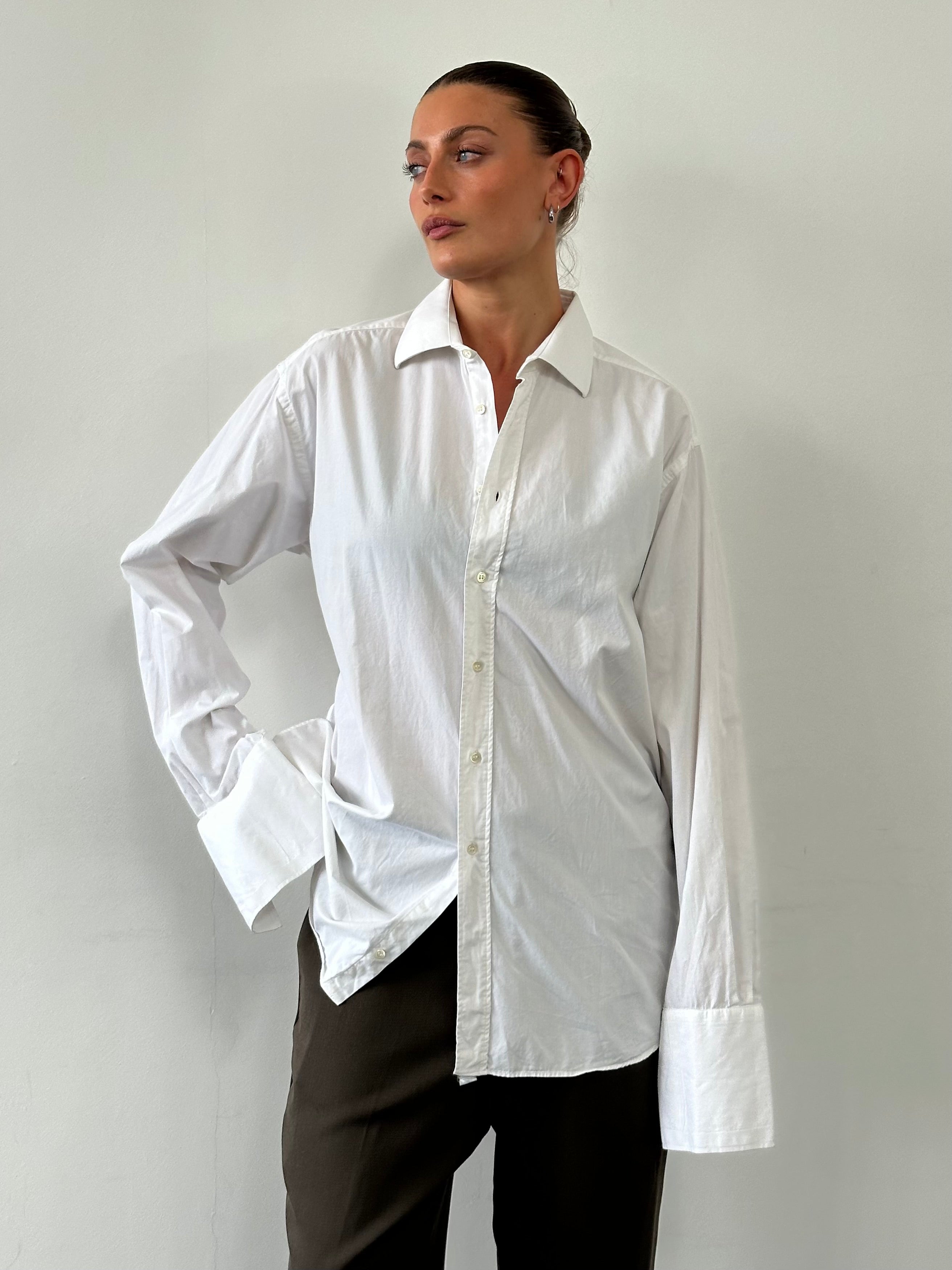Christian Dior cotton dress shirt in size L/XL, featuring classic collar and button front, white fabric with subtle texture.