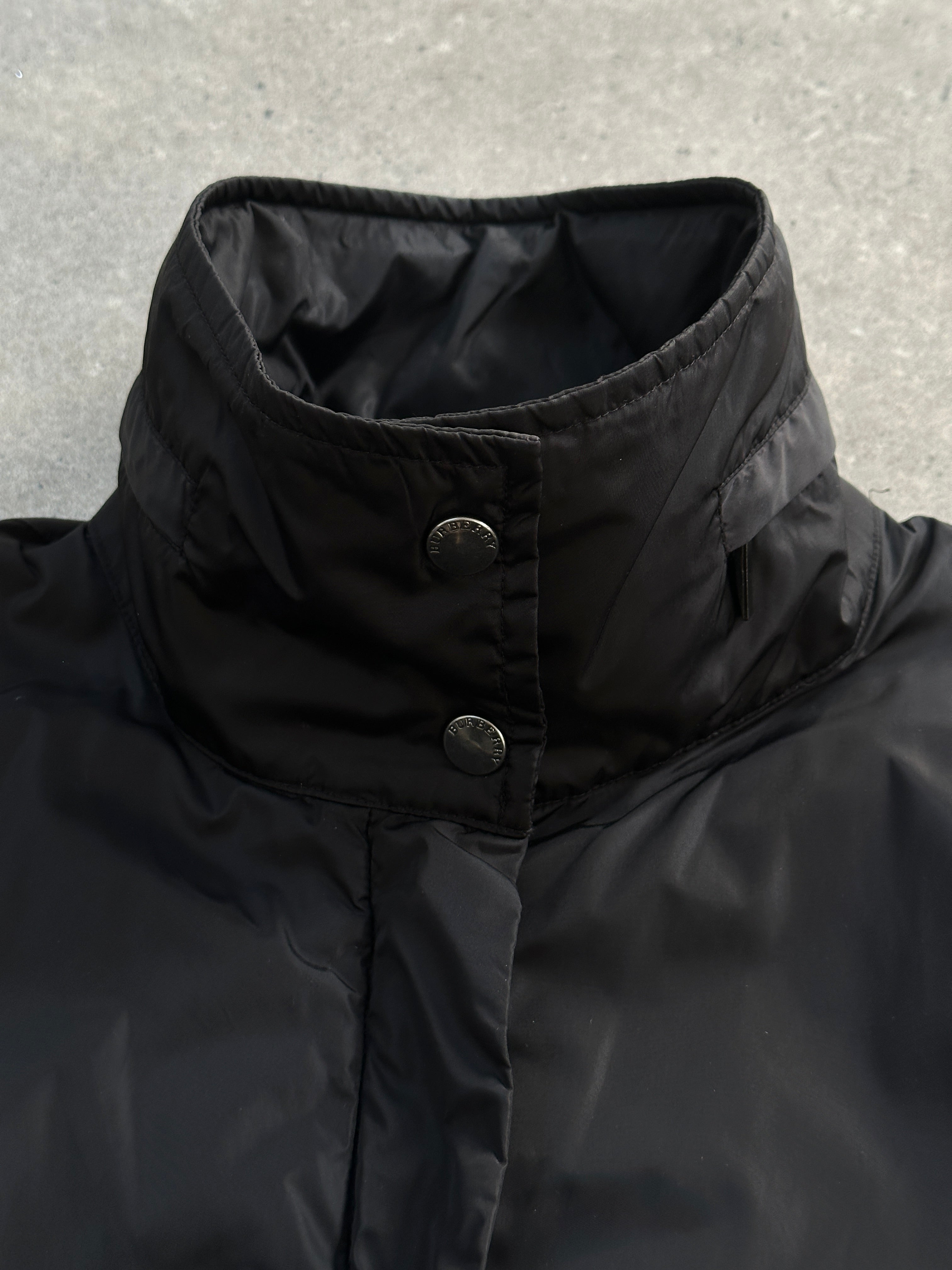 Burberry London 2000s nylon high neck jacket in black, featuring a high collar and sleek design, size large.