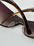 Prada Flame Rimless Wrap Sunglasses - SYLK