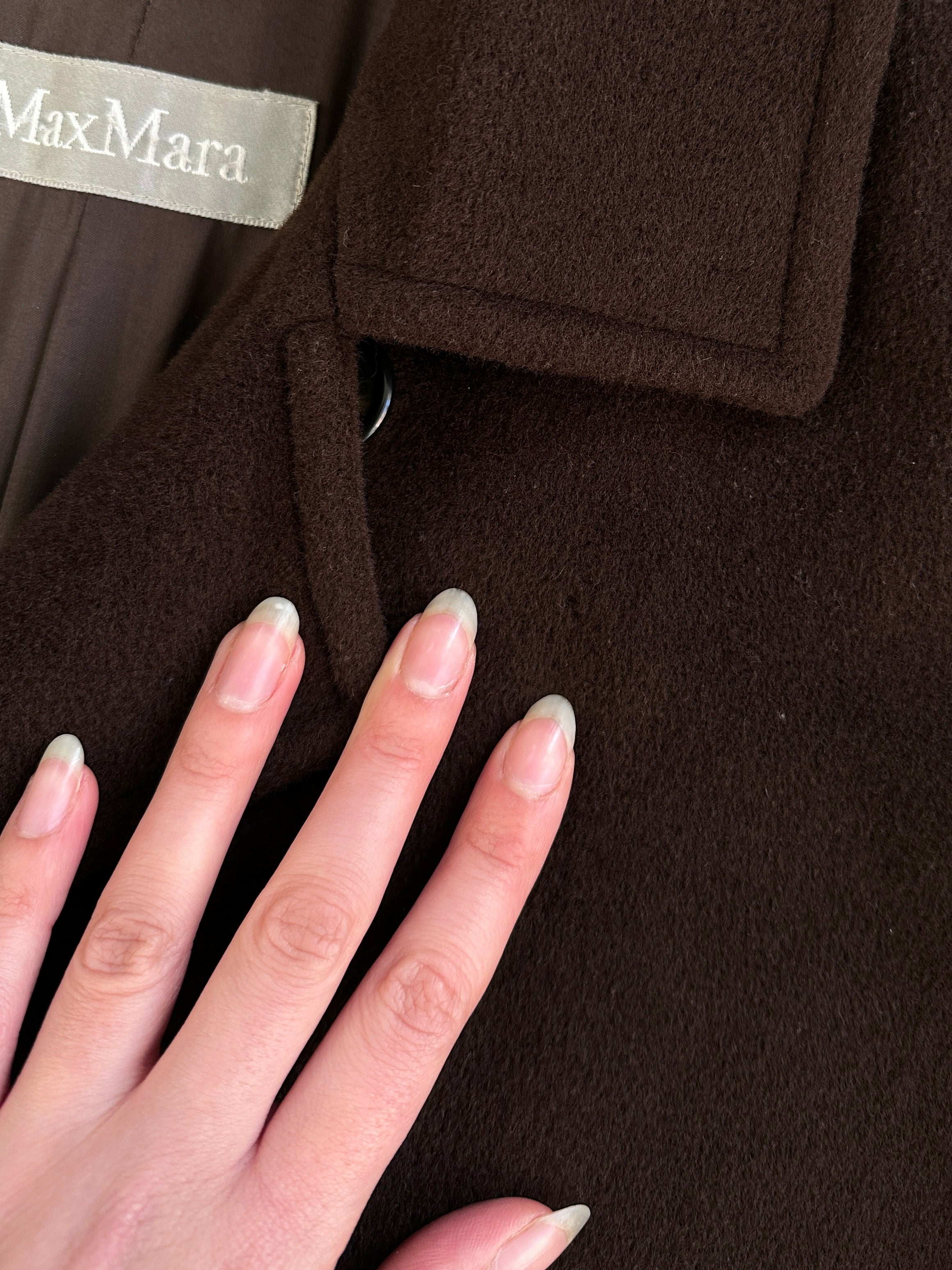 Max Mara pure virgin wool A-line coat in XL, shown hanging on a wooden rack with a tailored fit and classic design.