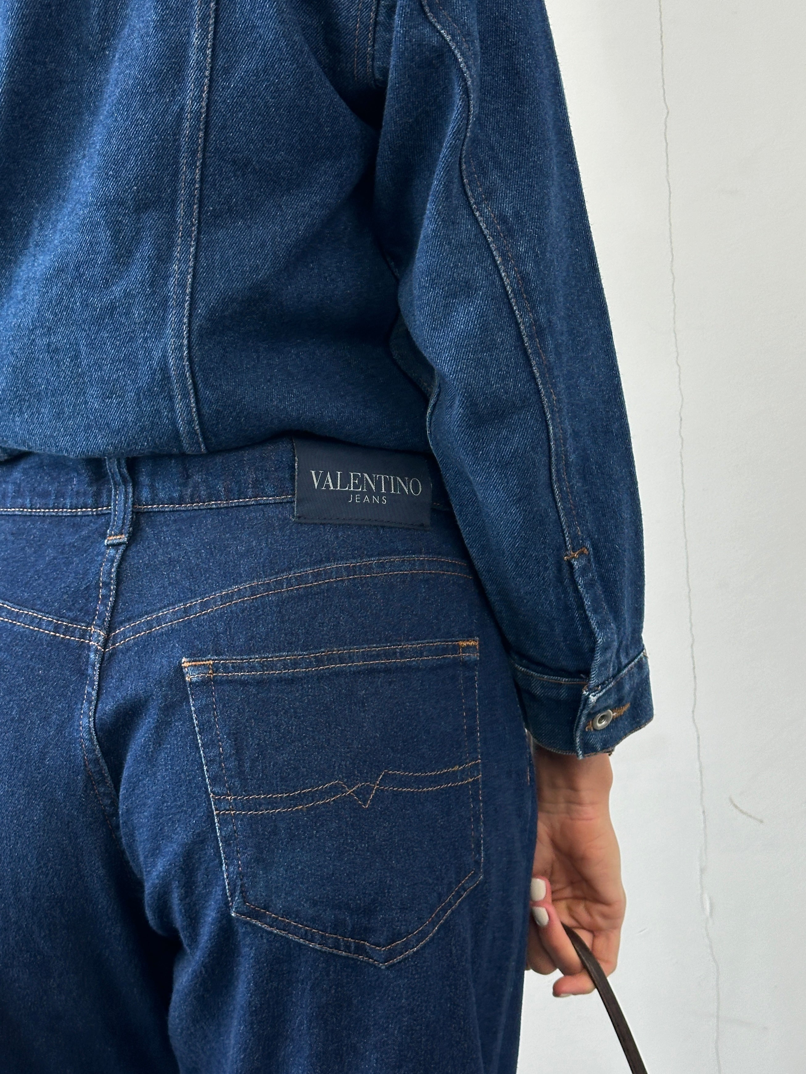 Valentino high waisted straight leg denim jeans in W34, showcasing classic fit and dark blue wash on a plain background.