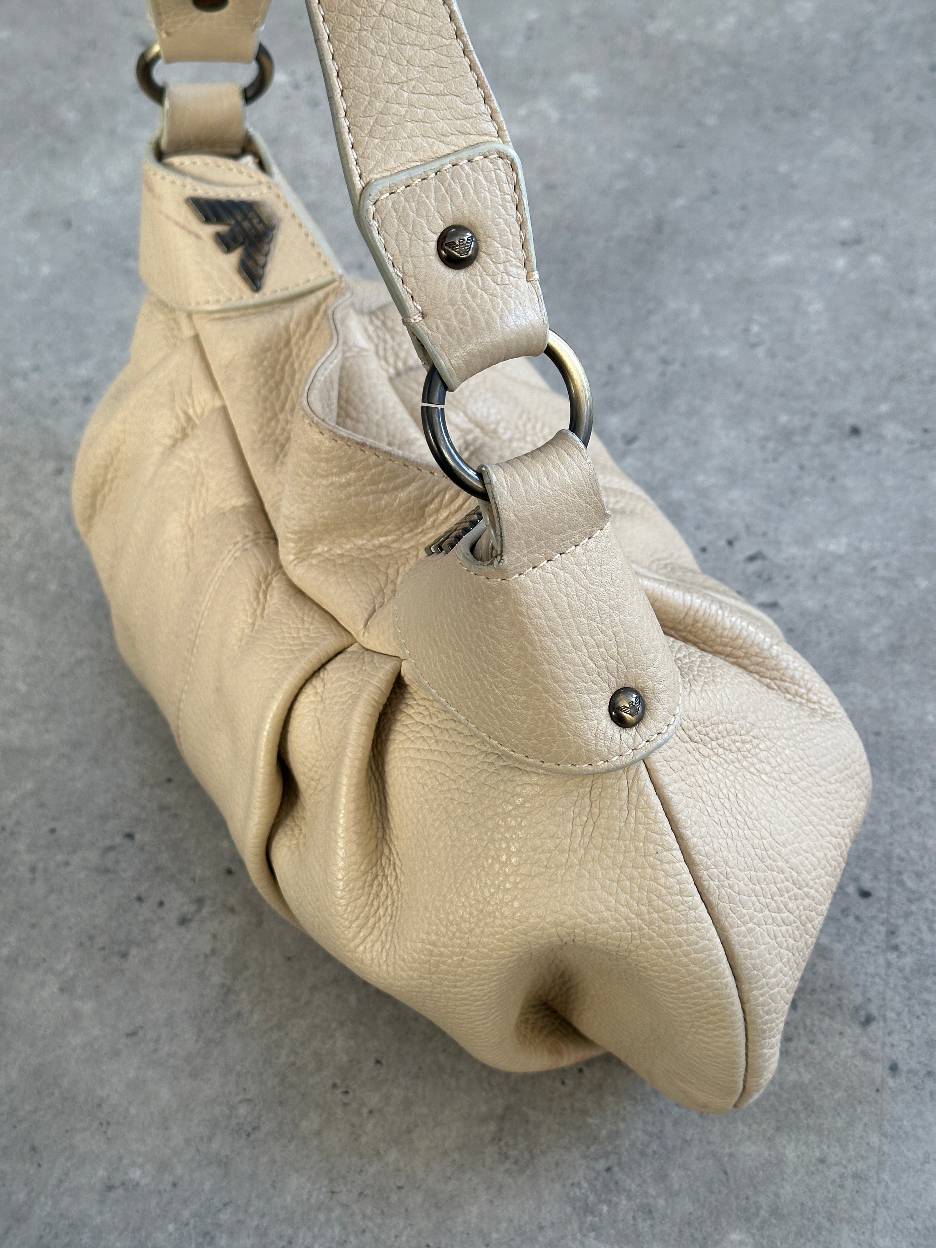 Emporio Armani leather pleated shoulder bag from the 2000s with a sleek design and adjustable shoulder strap.