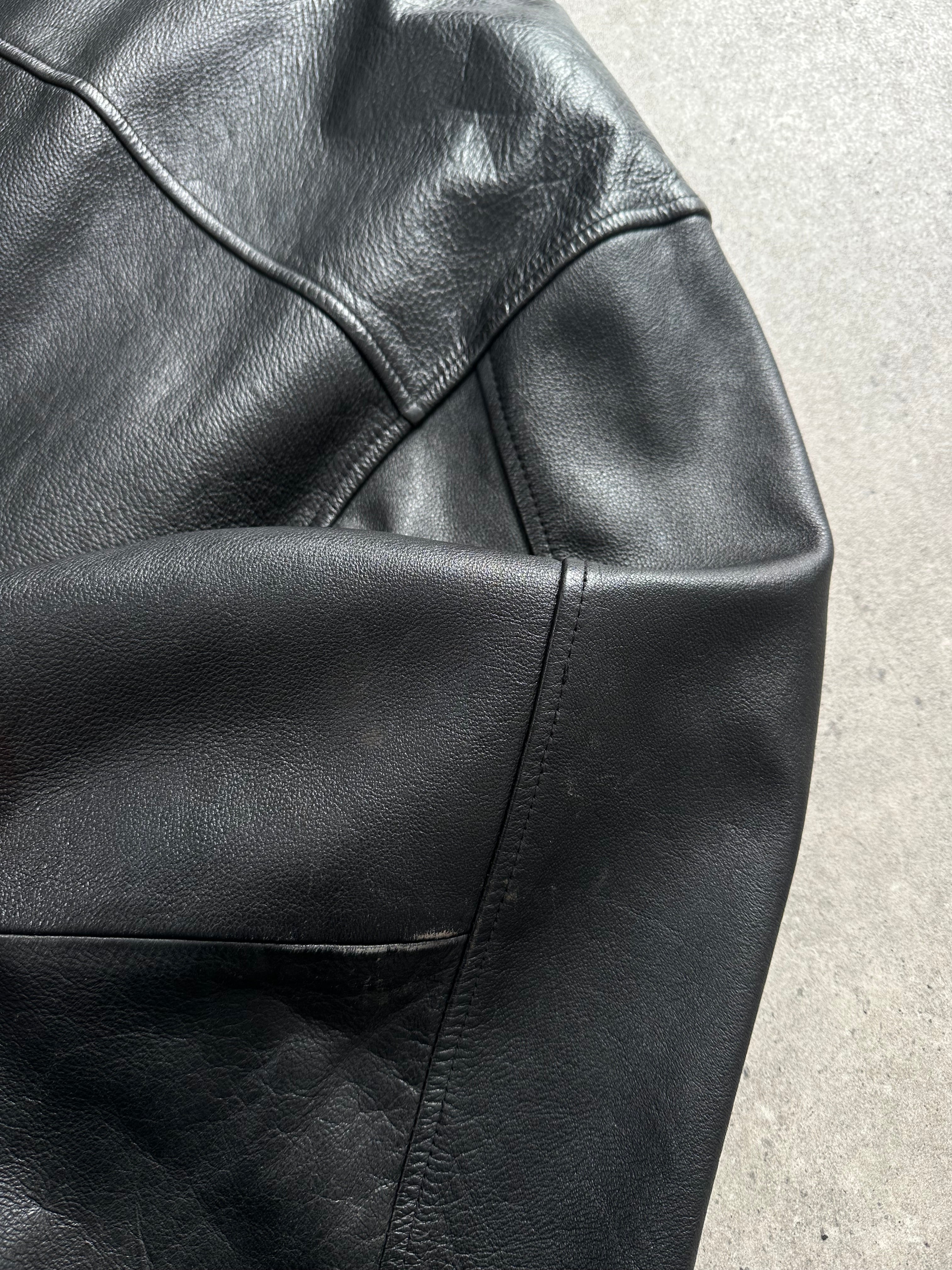 Vintage 1990s heavyweight leather jacket in XXL, minimal design with classic leather texture and vintage style.