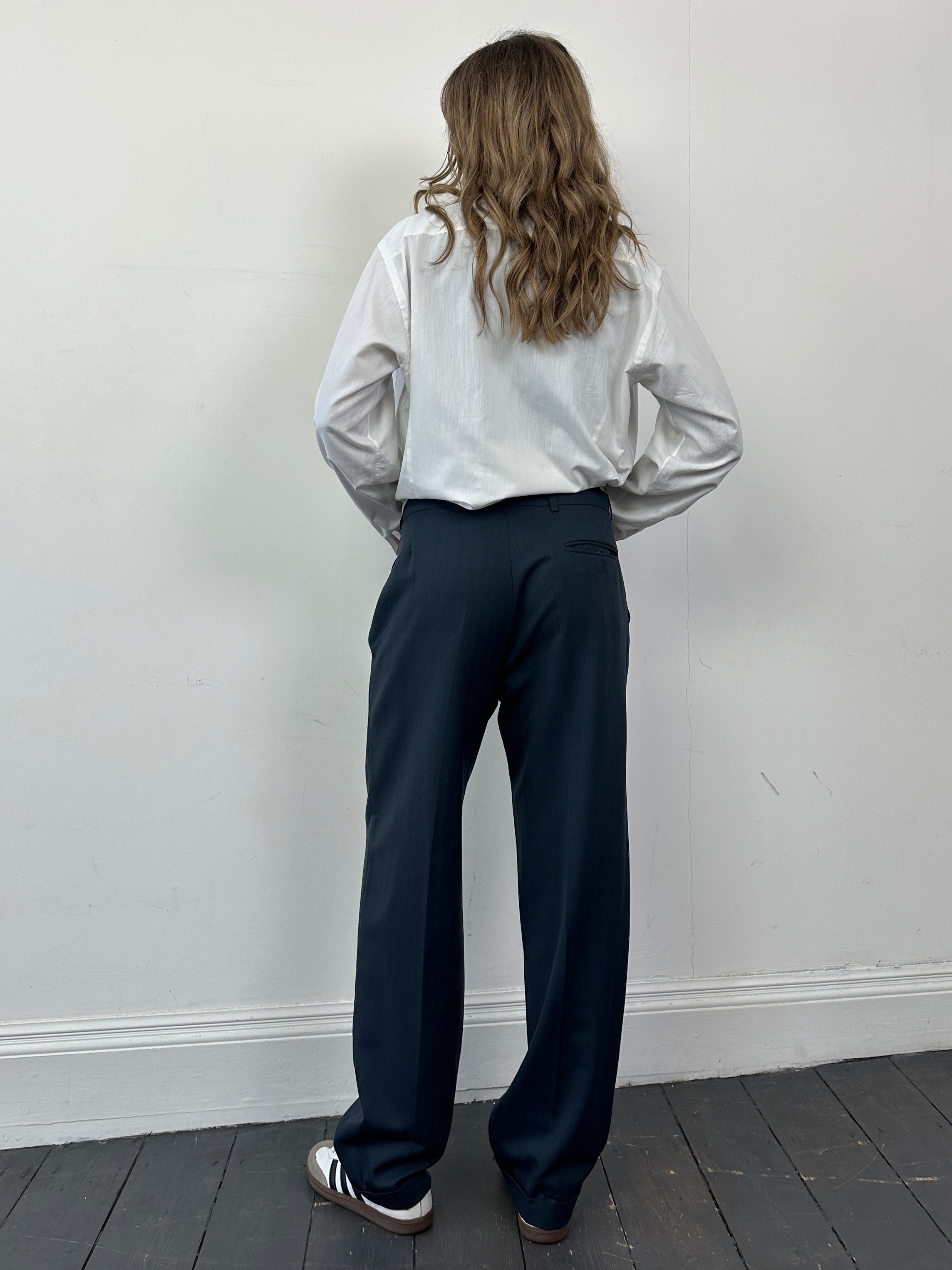 Christian Dior wool tapered leg tailored trousers in W32, shown in a classic tailored fit with a smooth fabric finish.