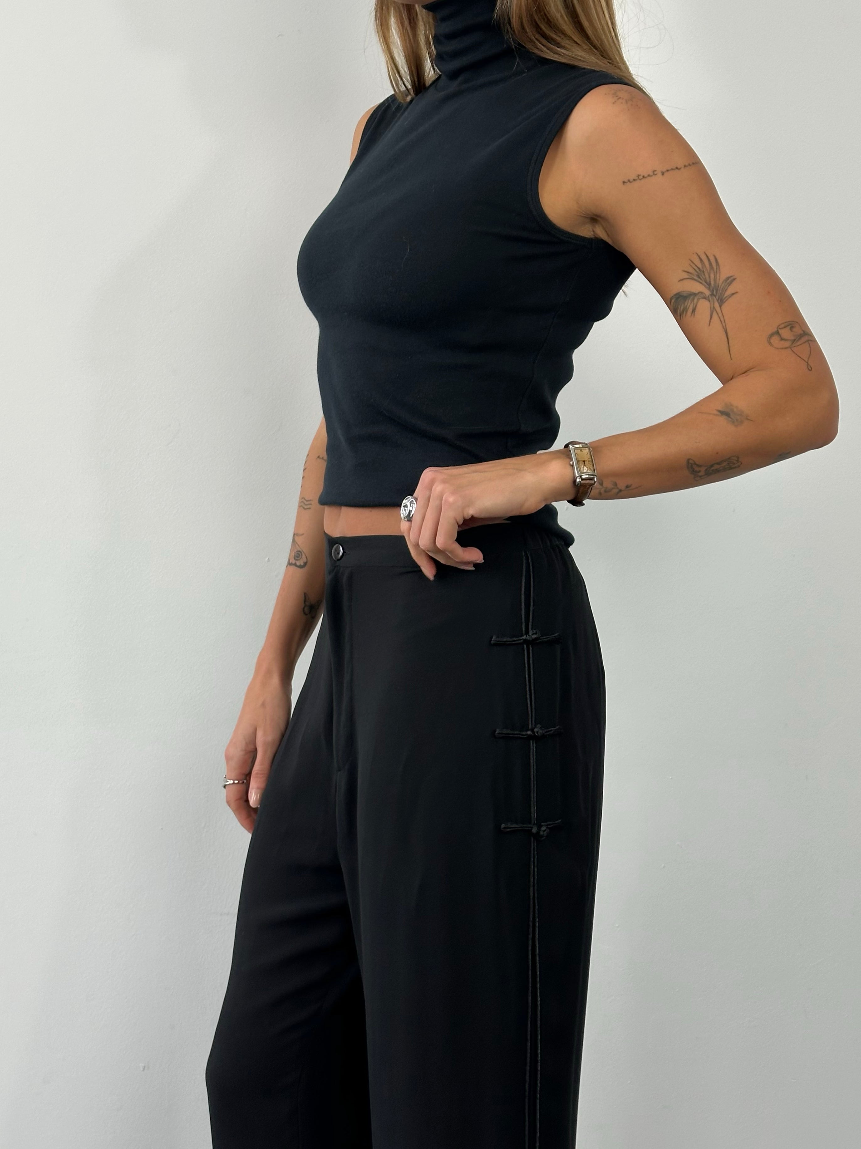 Vintage 1990s pure silk wide-leg trousers in size W28, showcasing luxurious fabric and classic wide-leg style.