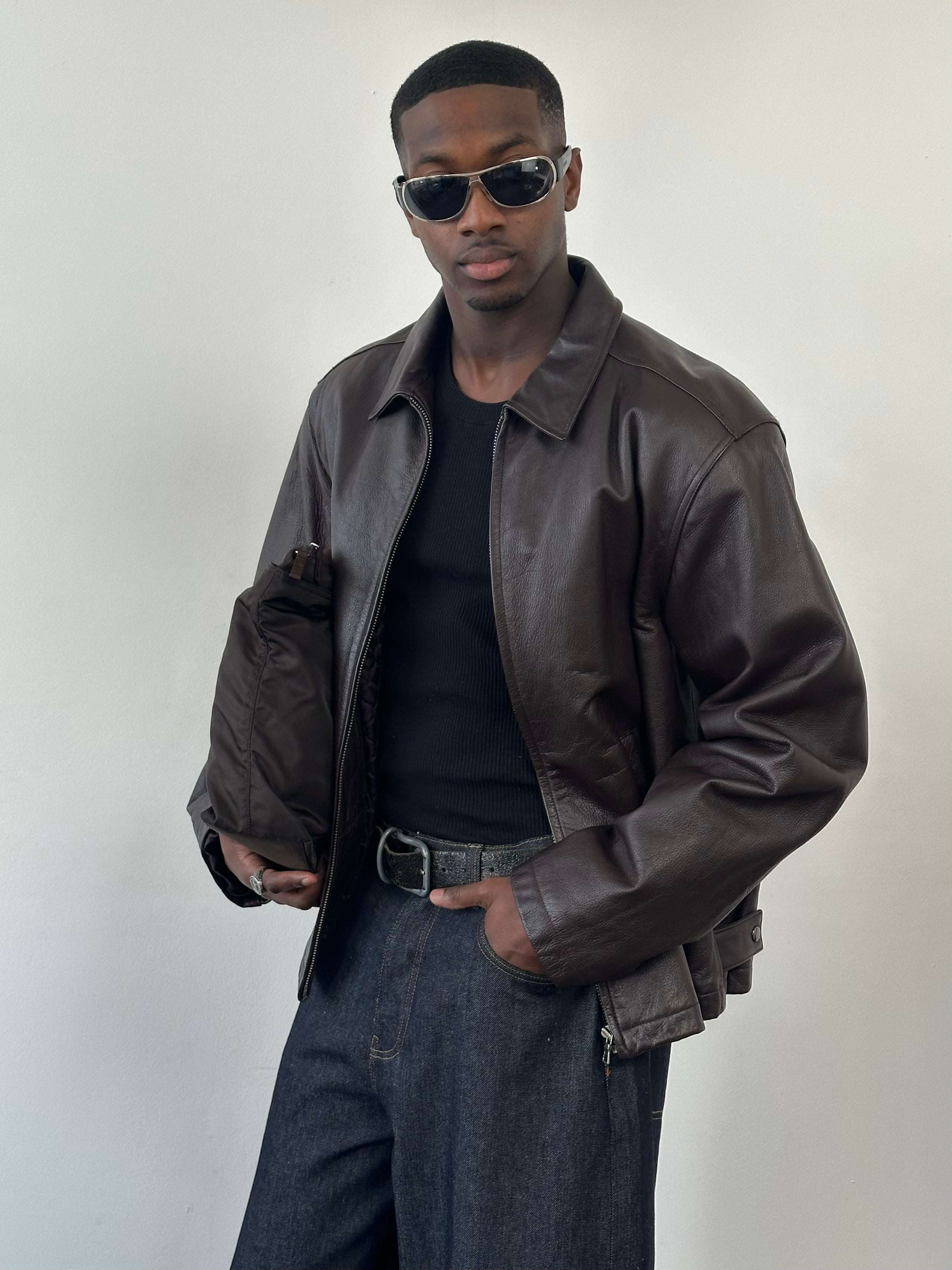 Vintage 1990s boxy minimal leather jacket in XL, showcasing classic design, soft leather texture, and stylish fit.