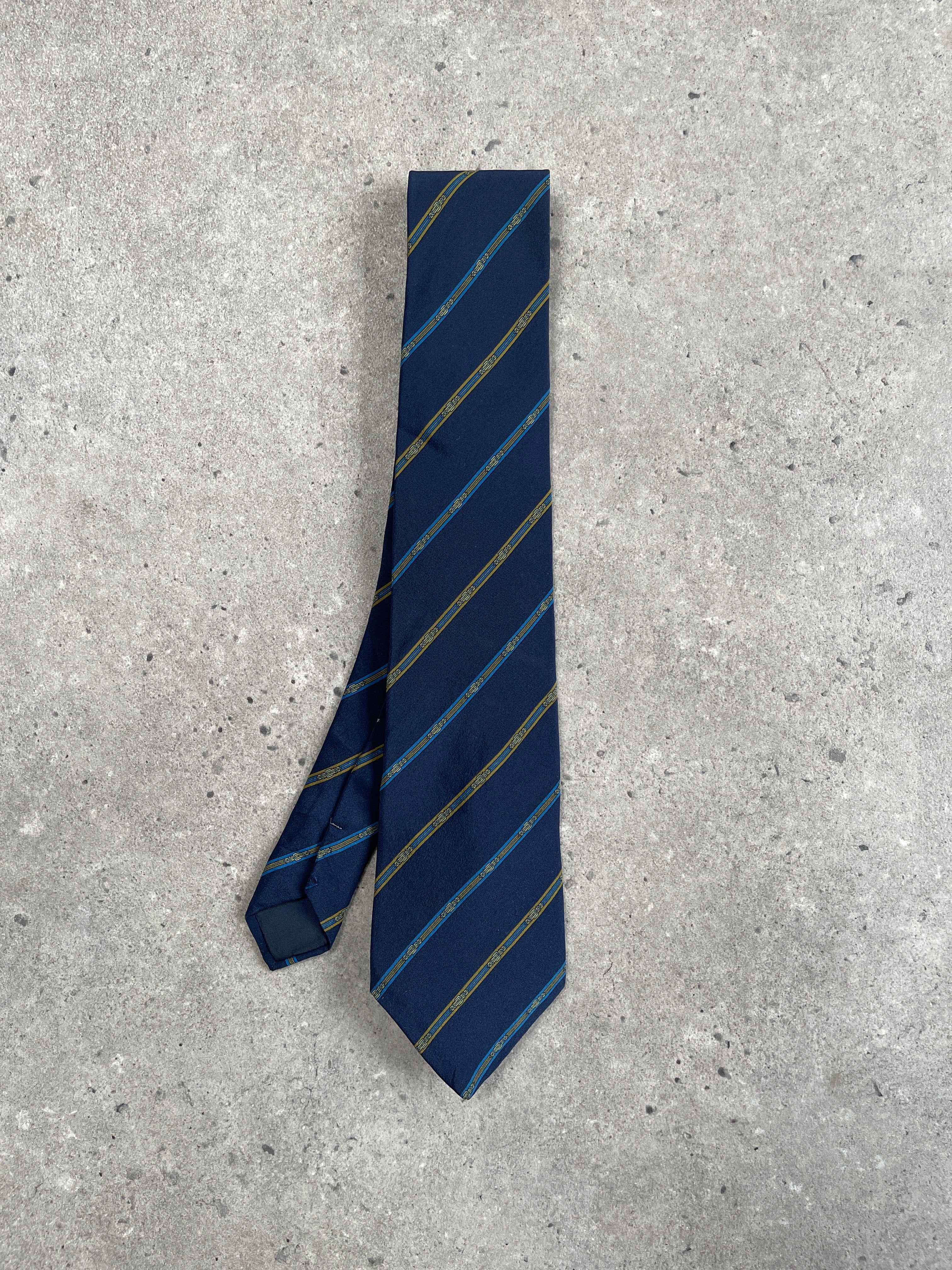 Lanvin Paris 1990s pure silk striped tie showcasing elegant blue, red, and white patterns on a smooth silk fabric.
