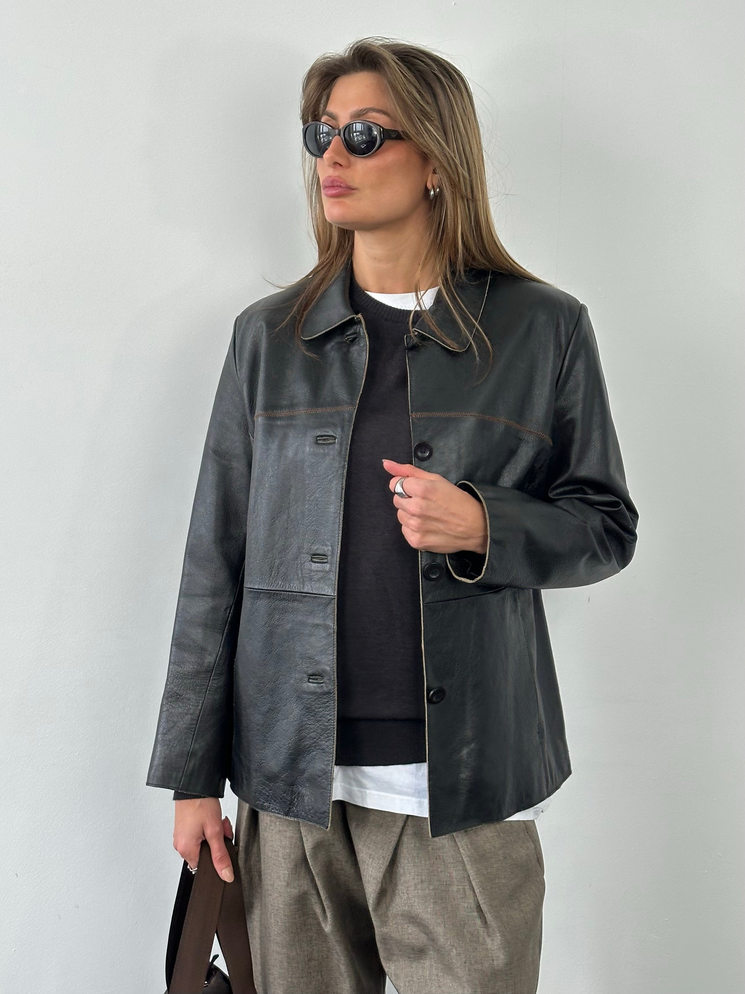 Vintage 1990s leather belted jacket, size small, featuring classic leather texture and vintage style, front view.