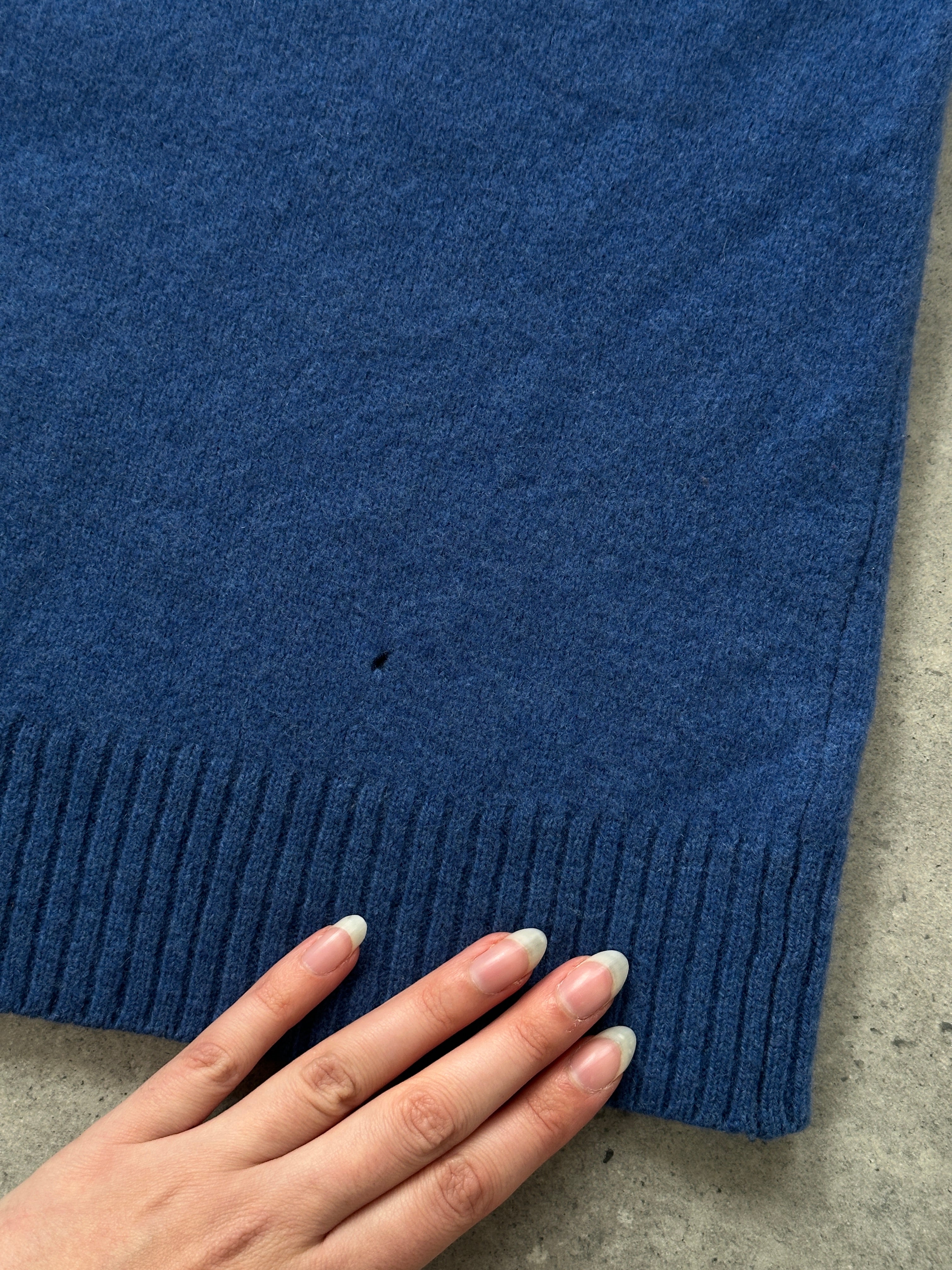 Burberry London pure wool logo jumper in size L, featuring the iconic Burberry design and classic wool texture.