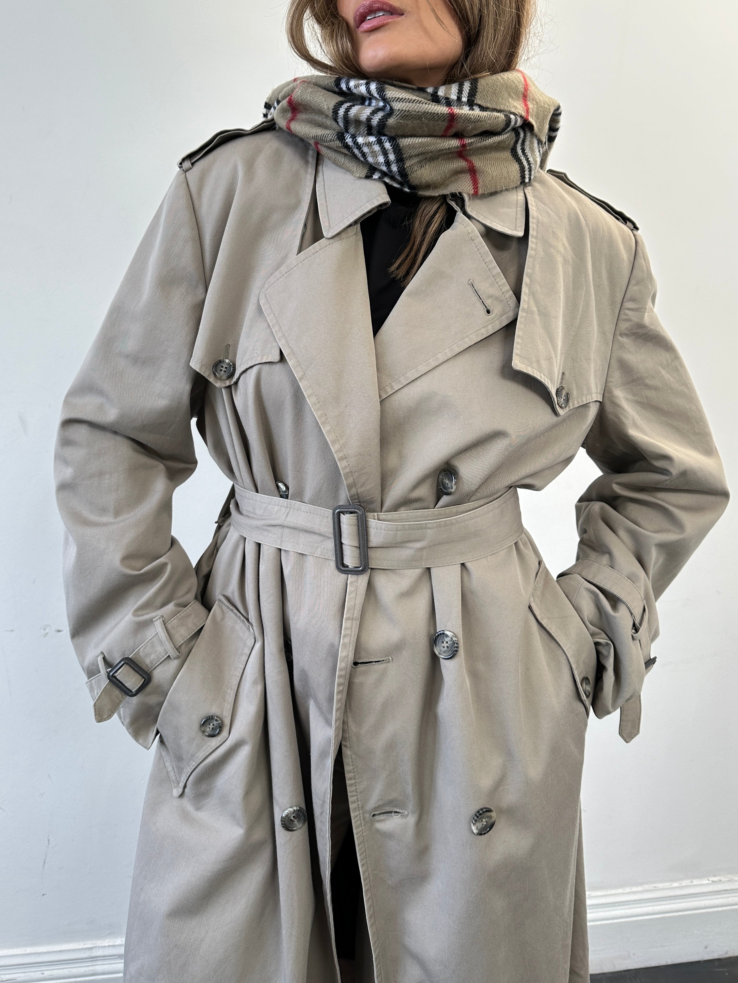 Christian Dior double-breasted cotton trench coat in size L/XL, shown with classic collar and button details.