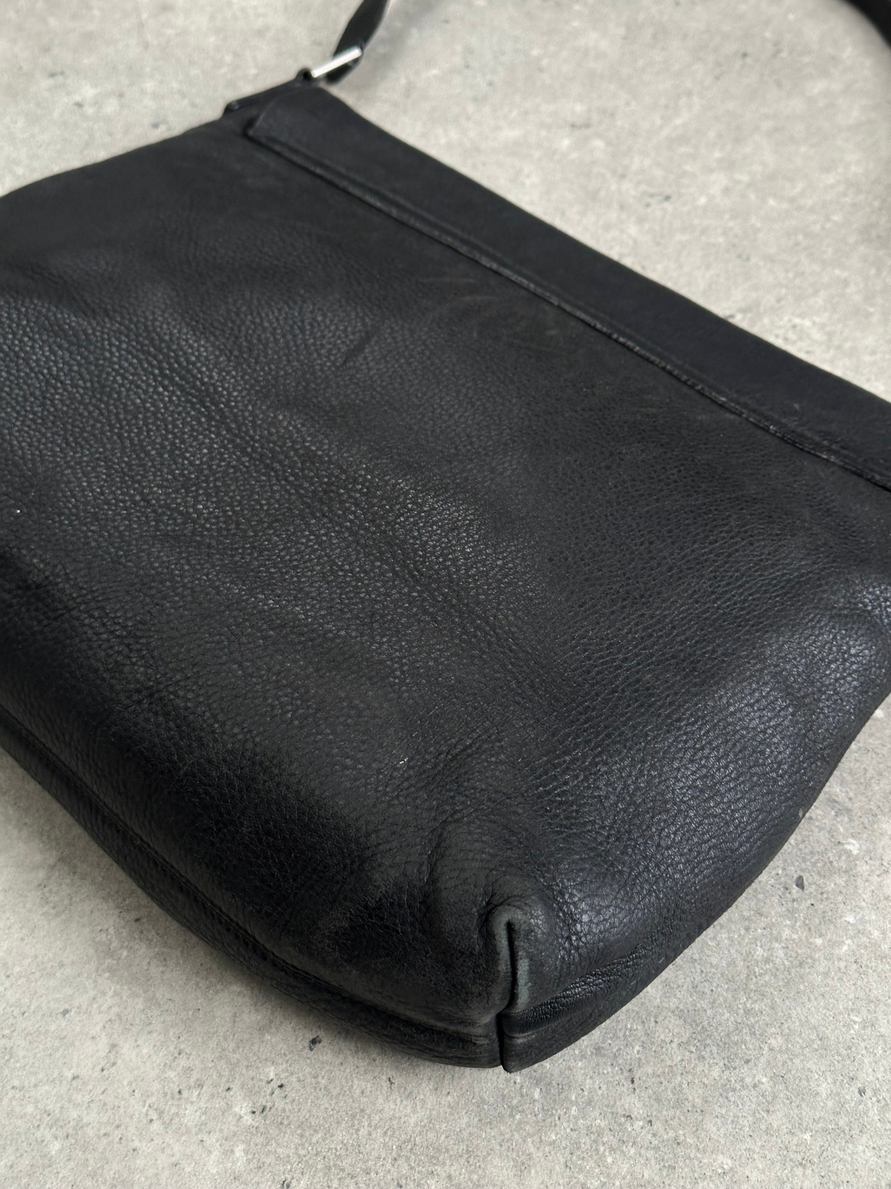 Giorgio Armani leather crossbody bag from the 2000s with a sleek design and adjustable strap, featuring classic Armani branding.