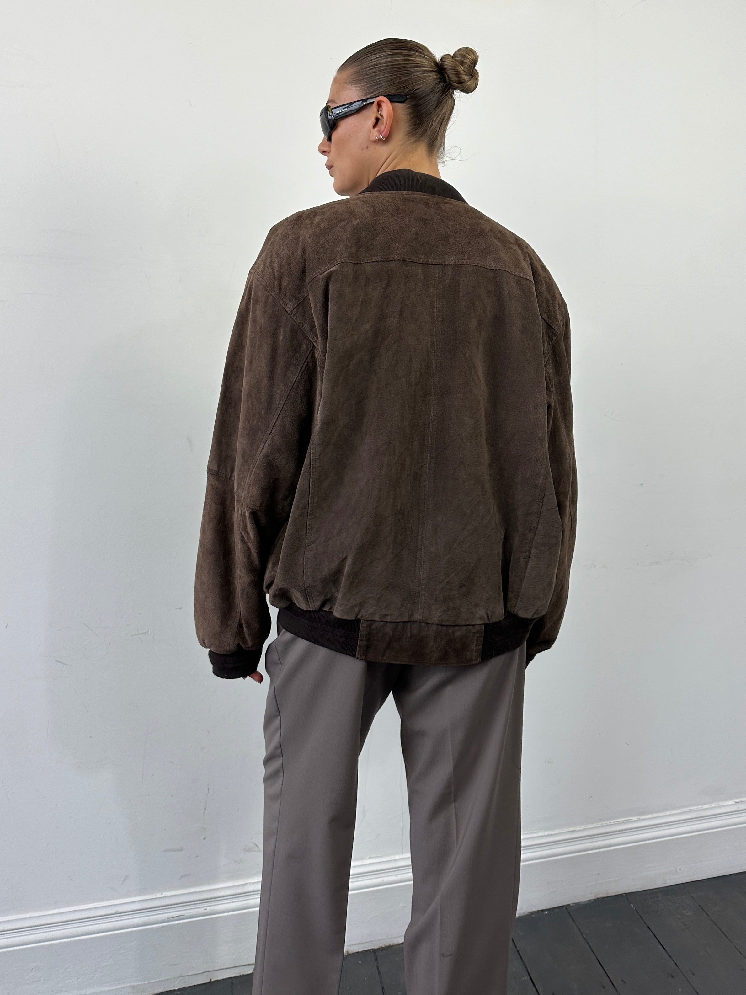 Vintage suede leather bomber jacket in XL, featuring classic design and soft texture, shown from the front view.