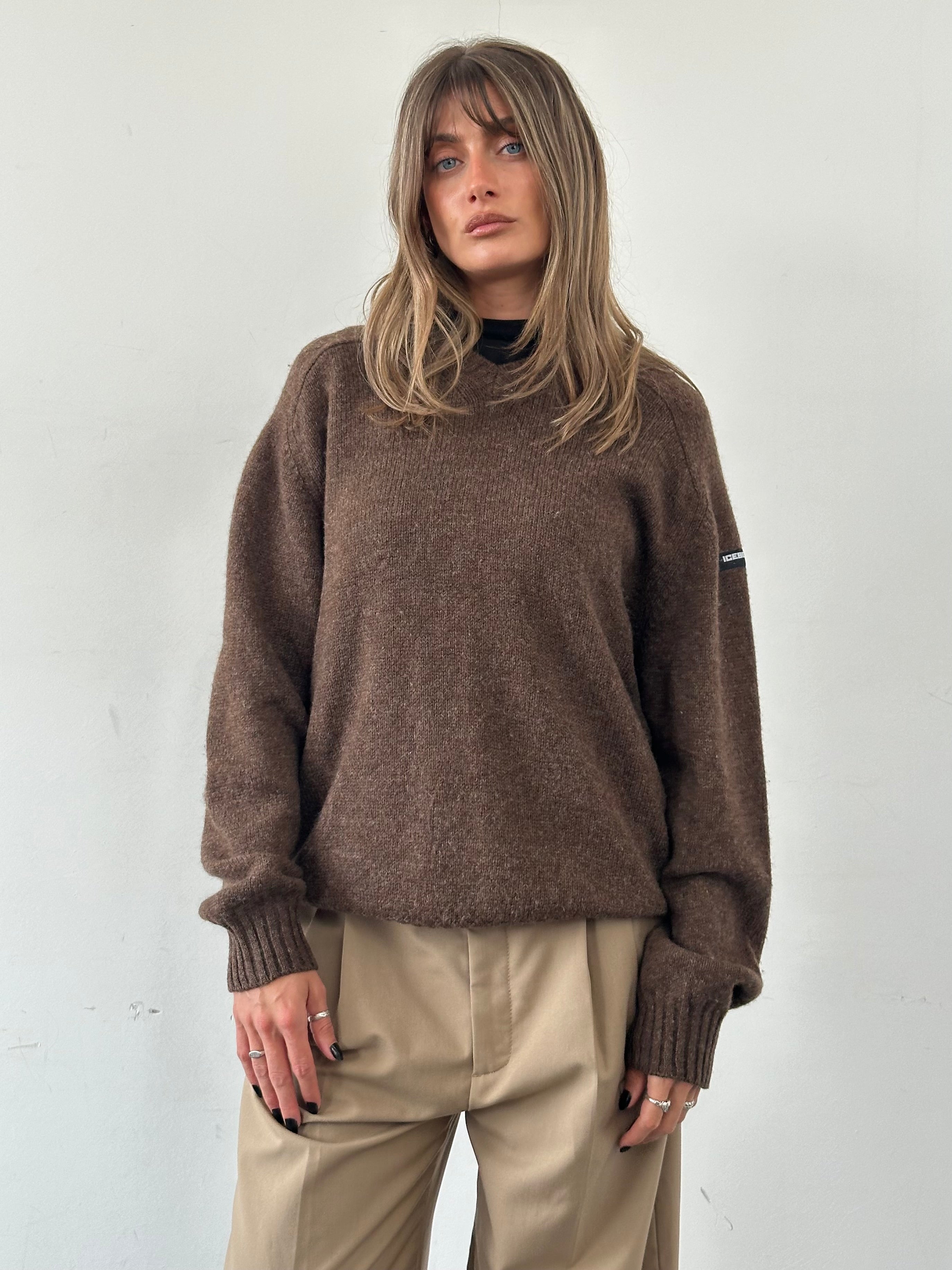 Iceberg pure wool V-neck jumper in XL, featuring a soft knit texture and classic design, displayed on a neutral background.