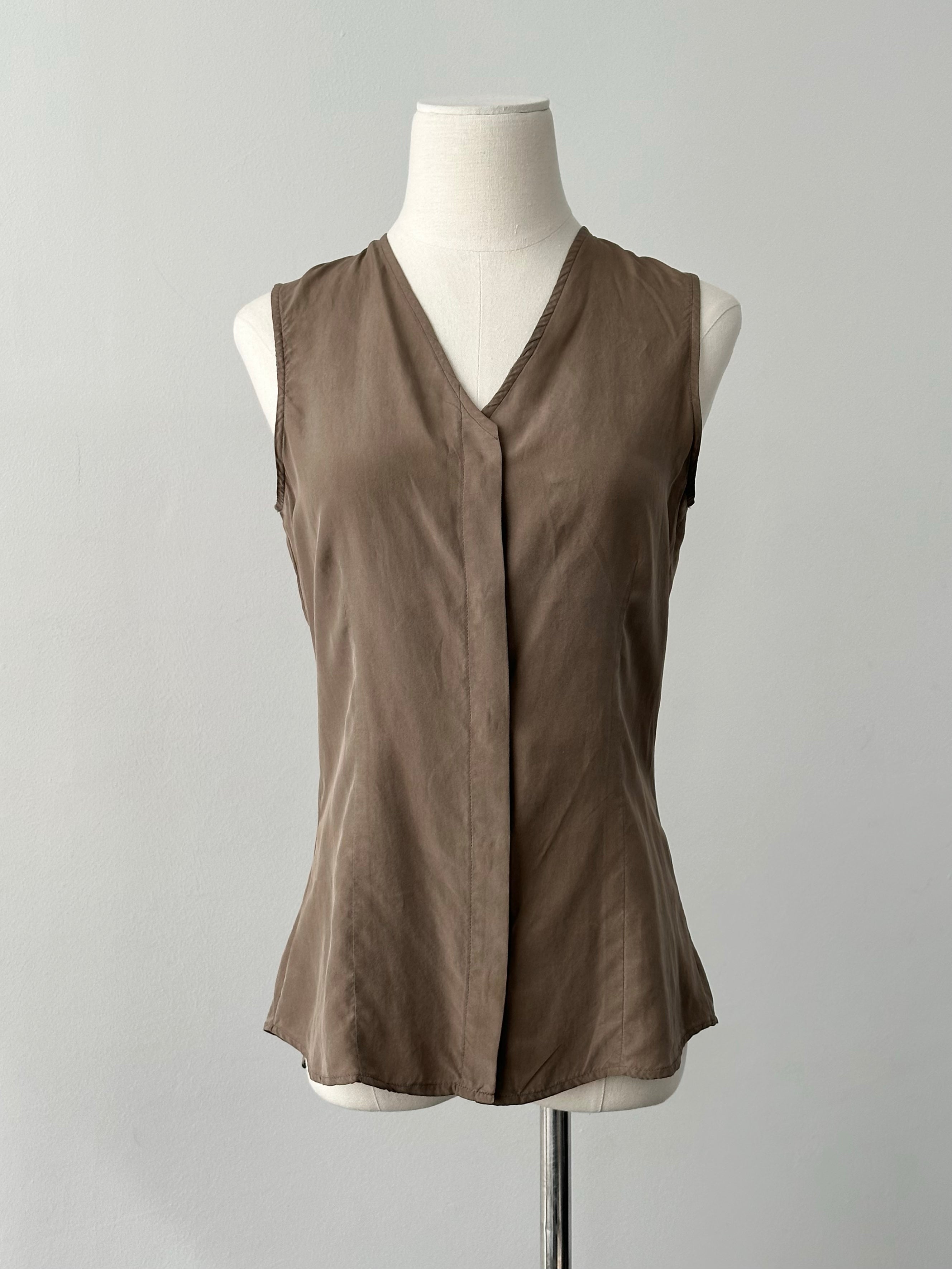 Emporio Armani 2000s pure silk sleeveless top in white, minimal design, fitted style, with a high neckline and sleeveless cut.