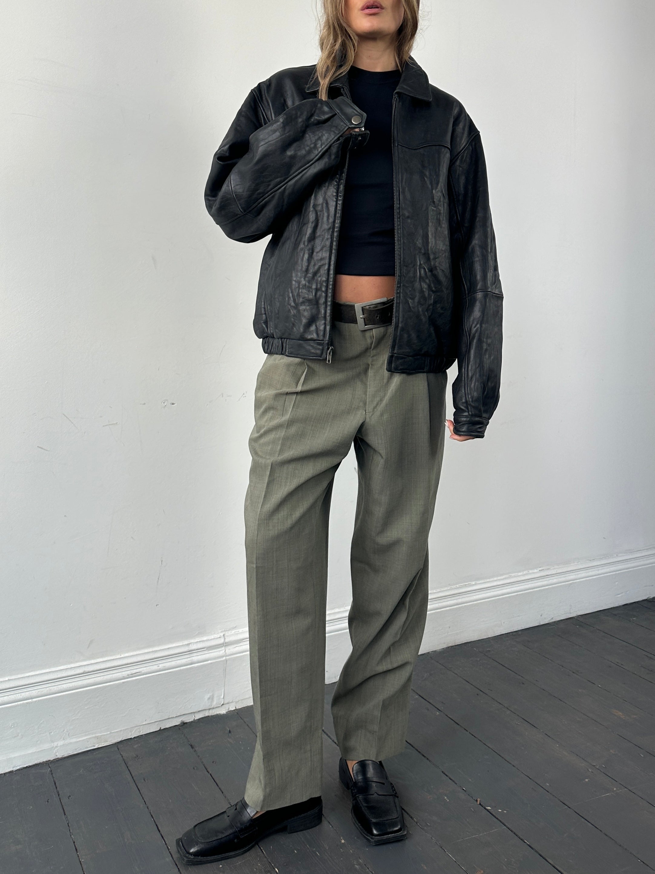 Vintage brand vintage minimal soft leather bomber jacket in size M, showing its classic design and smooth leather texture.