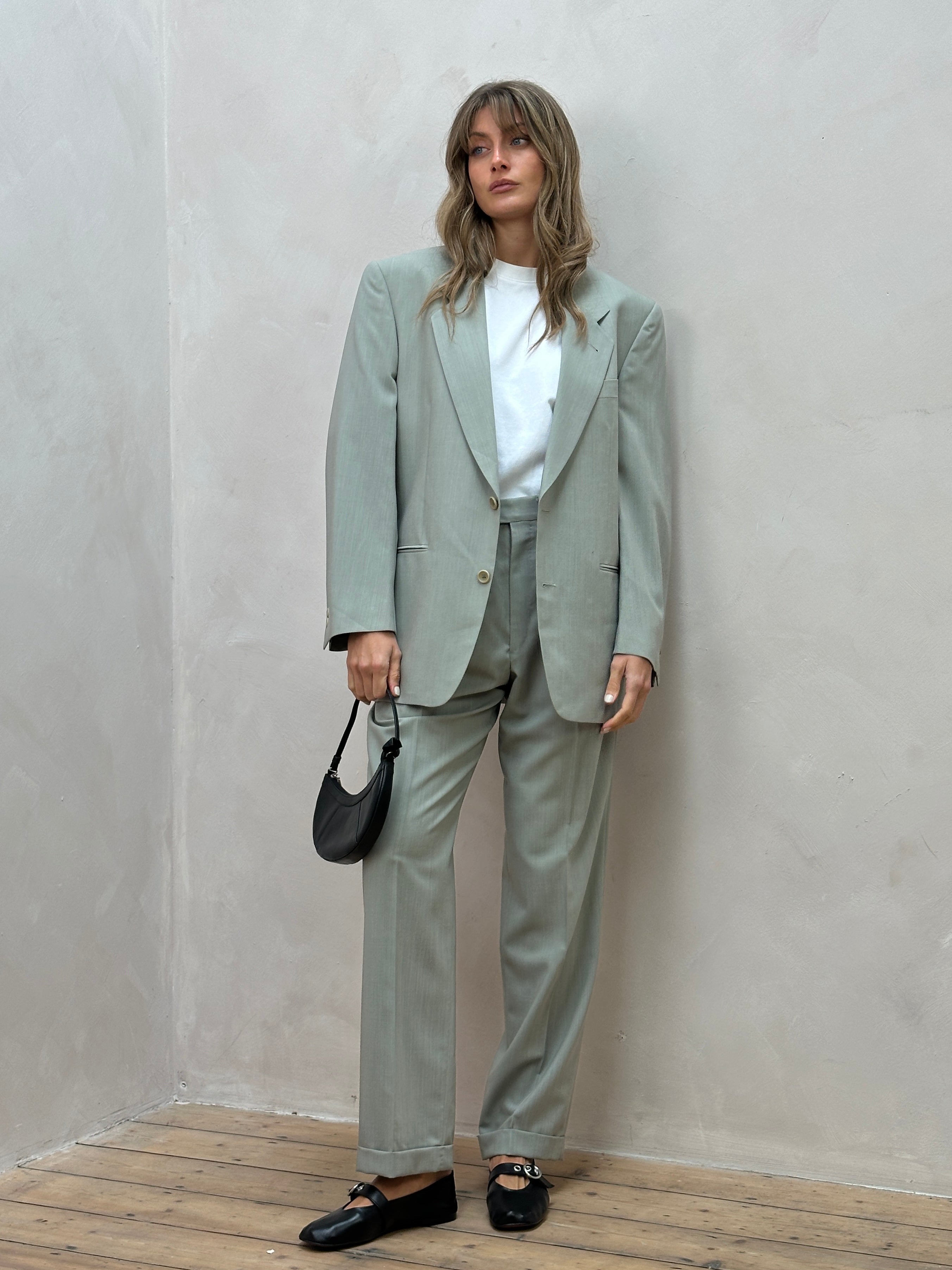 Vintage Italian vintage pure wool single-breasted suit jumpsuit in size 38R/W30, featuring classic tailored design and elegant fabric.