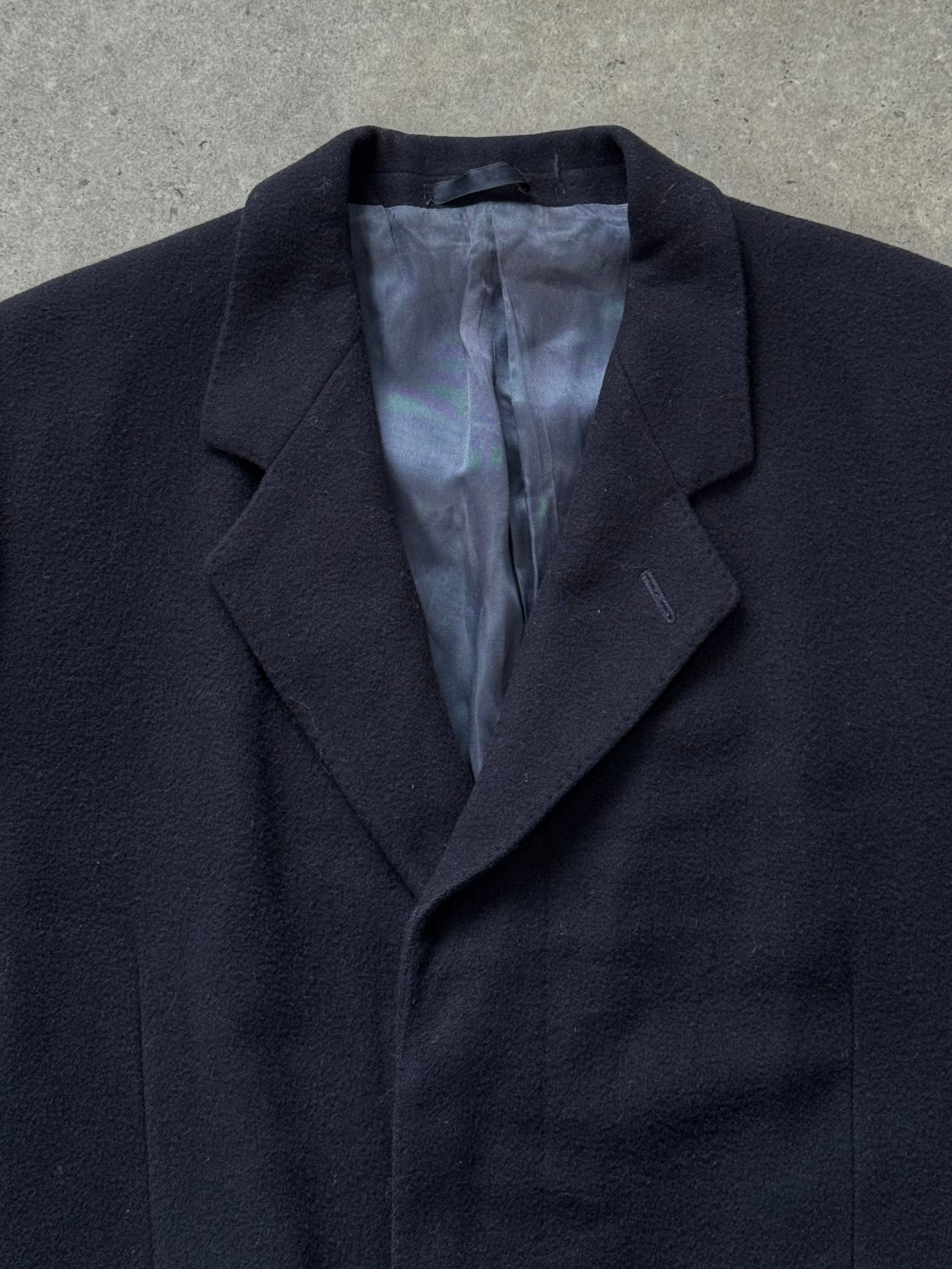 Vintage 1990s pure wool single-breasted coat in size L, classic style with tailored lapels and button closure.