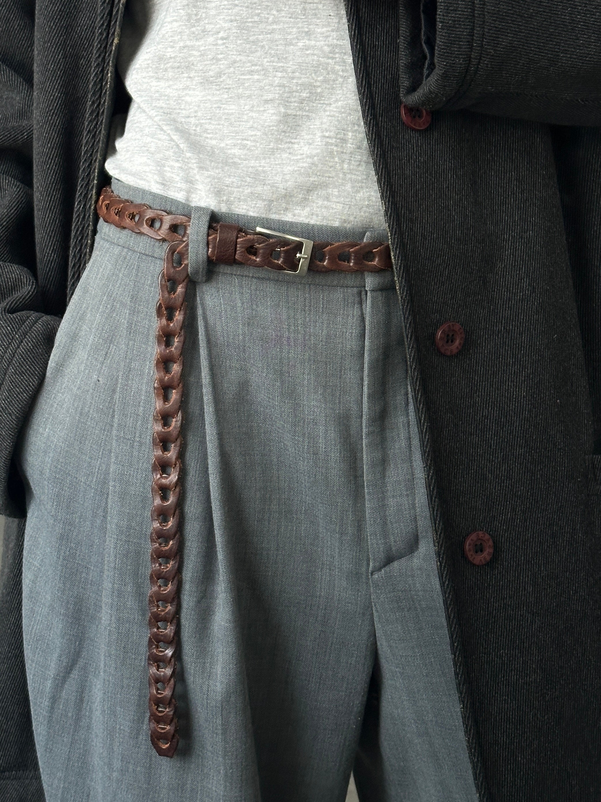 Vintage Italian 1990s leather adjustable belt, one size, featuring classic craftsmanship and aged leather in natural tones.