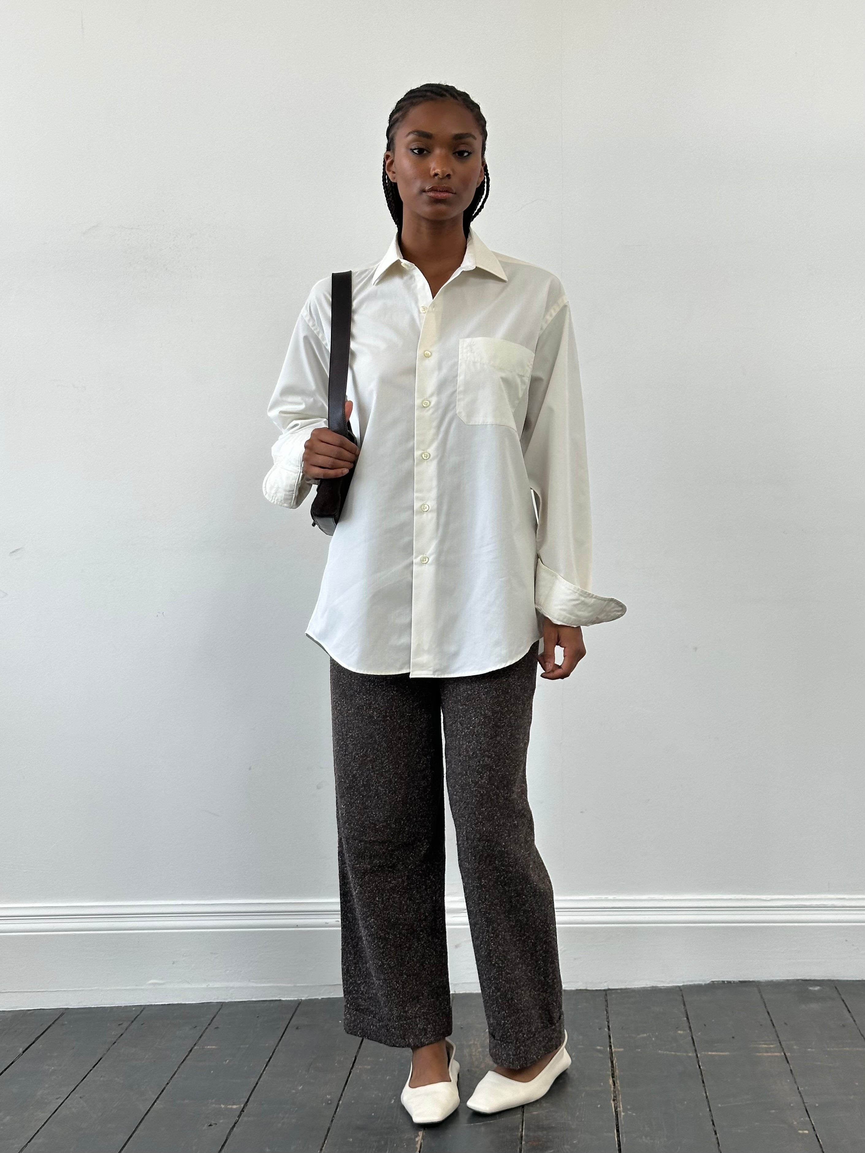 Vintage high waisted wide leg trousers from the 1990s, in W24 size, featuring classic denim fabric and relaxed fit.
