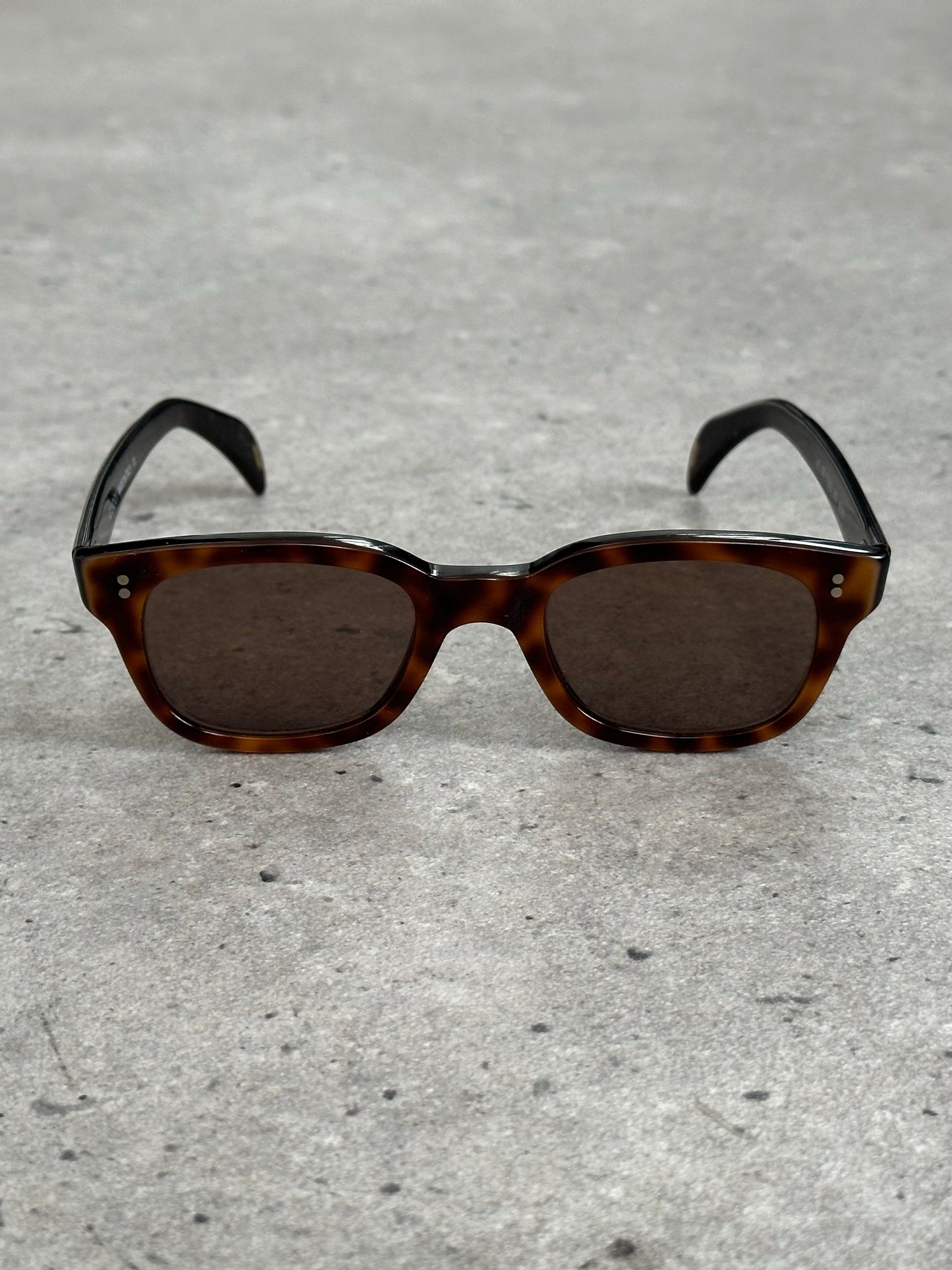 Gucci 2000s Tom Ford tortoiseshell rectangle logo sunglasses with dark lenses and bold frame, stylish eyewear for fashion-forward looks