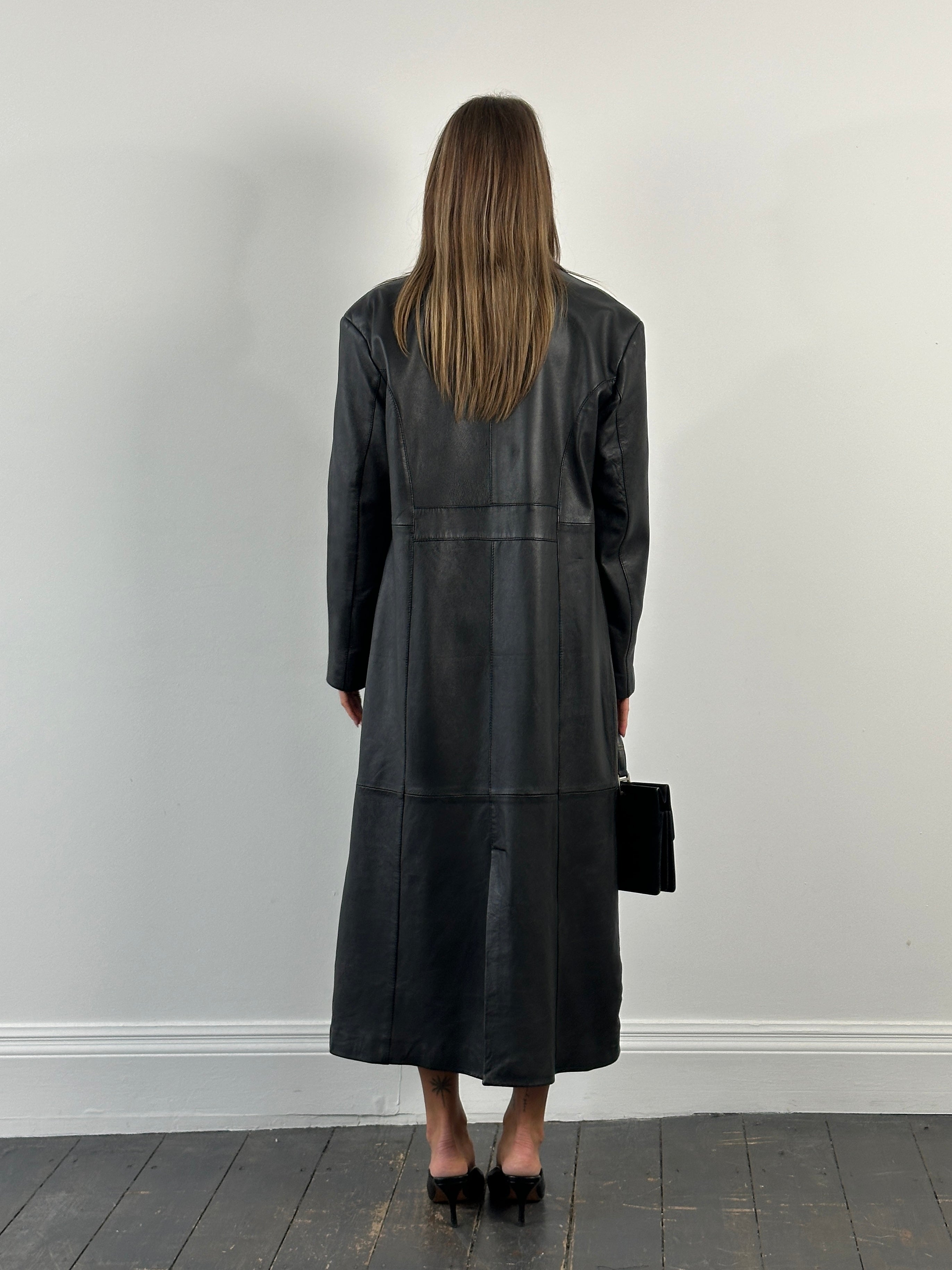 Vintage 1990s leather trench coat, full-length leather jacket in size large, classic vintage style with a sleek silhouette.