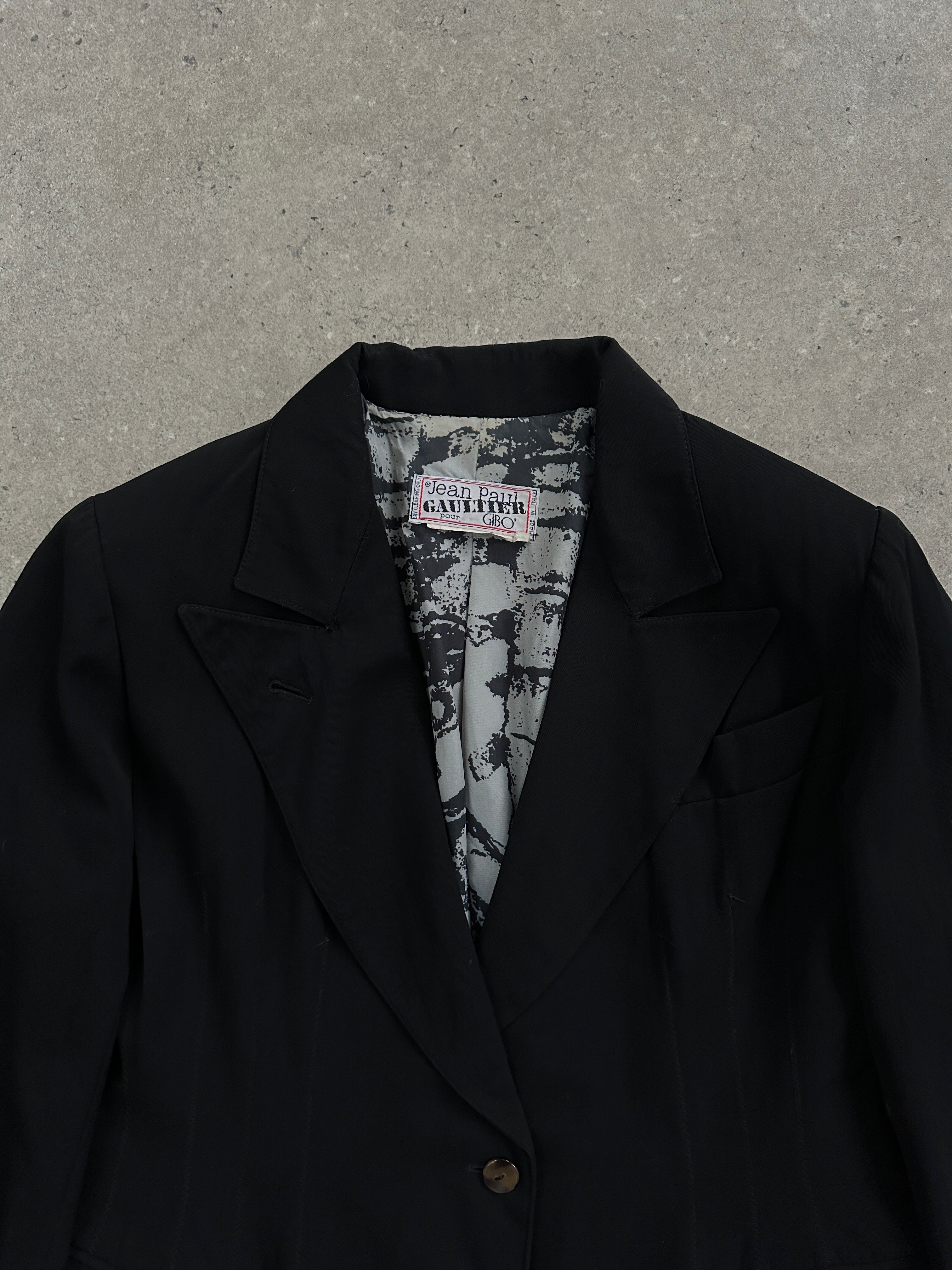 Jean Paul Gaultier 80s wool waist blazer in black, tailored fit with structured shoulders and classic lapel details.