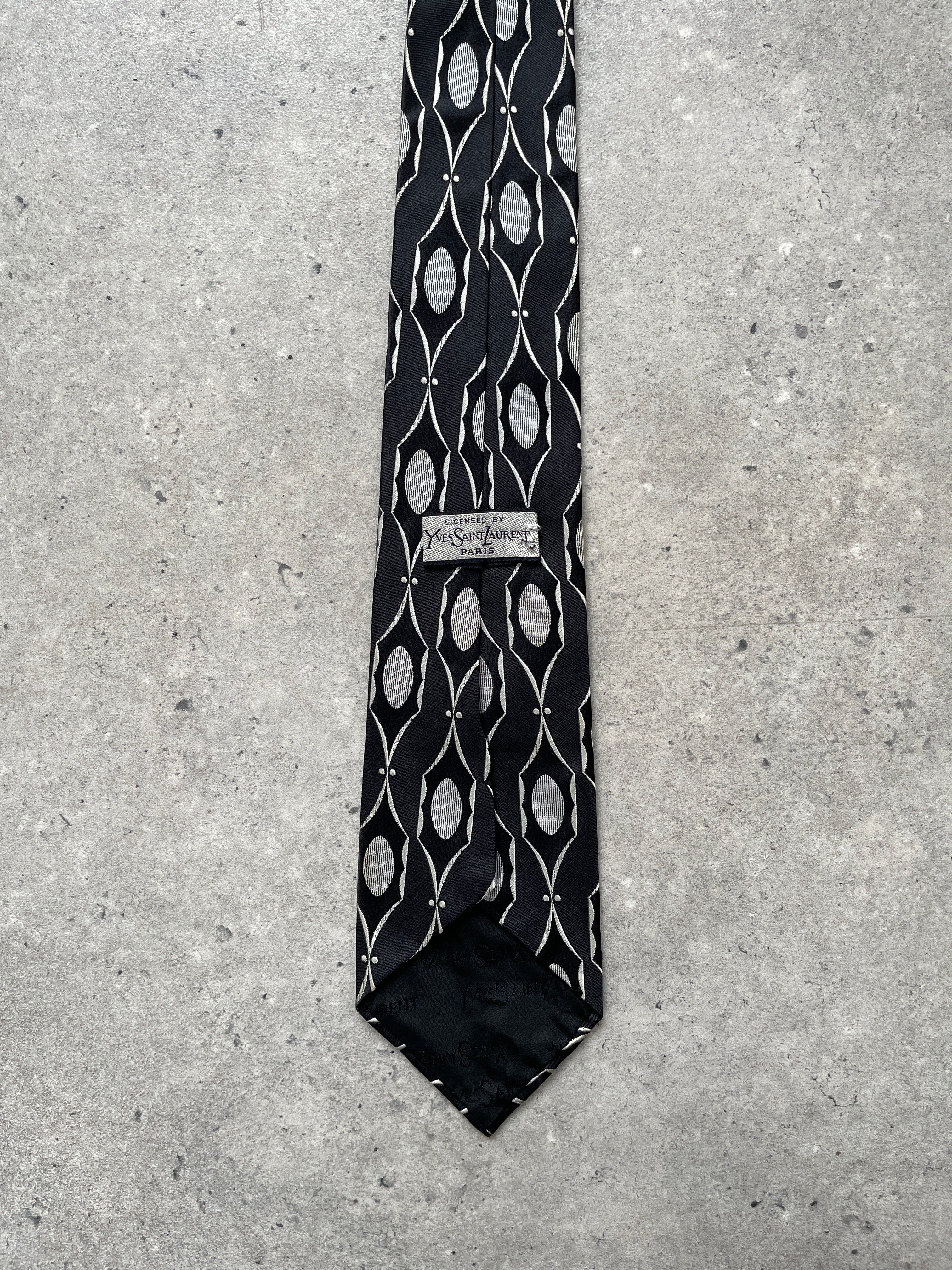 Yves Saint Laurent Paris 1990s pure silk print tie with intricate floral pattern, classic and elegant accessory for formal wear.