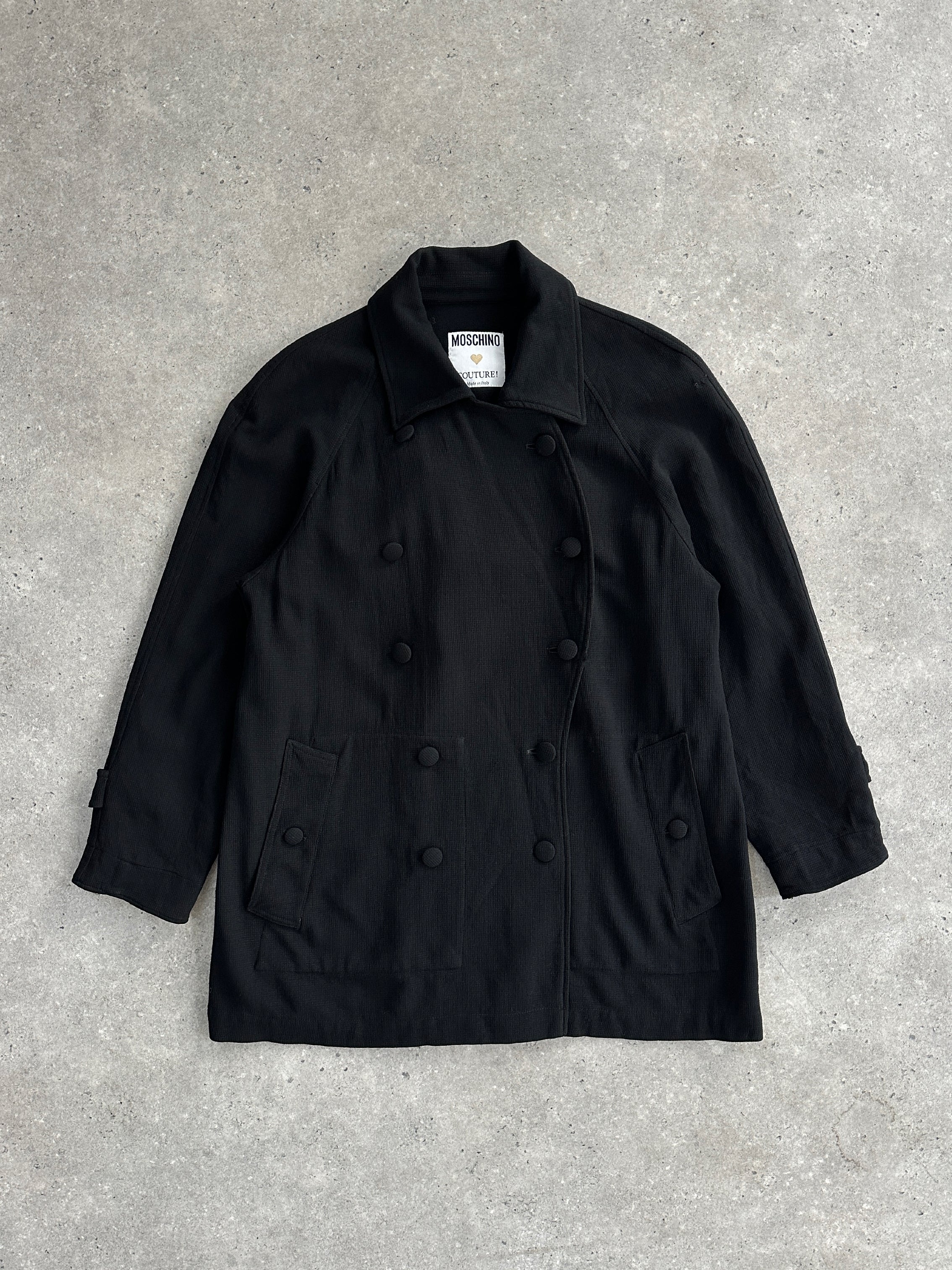 Moschino Couture 1990s pure wool double-breasted curved coat in size L, featuring a classic tailored design with a stylish lapel collar.