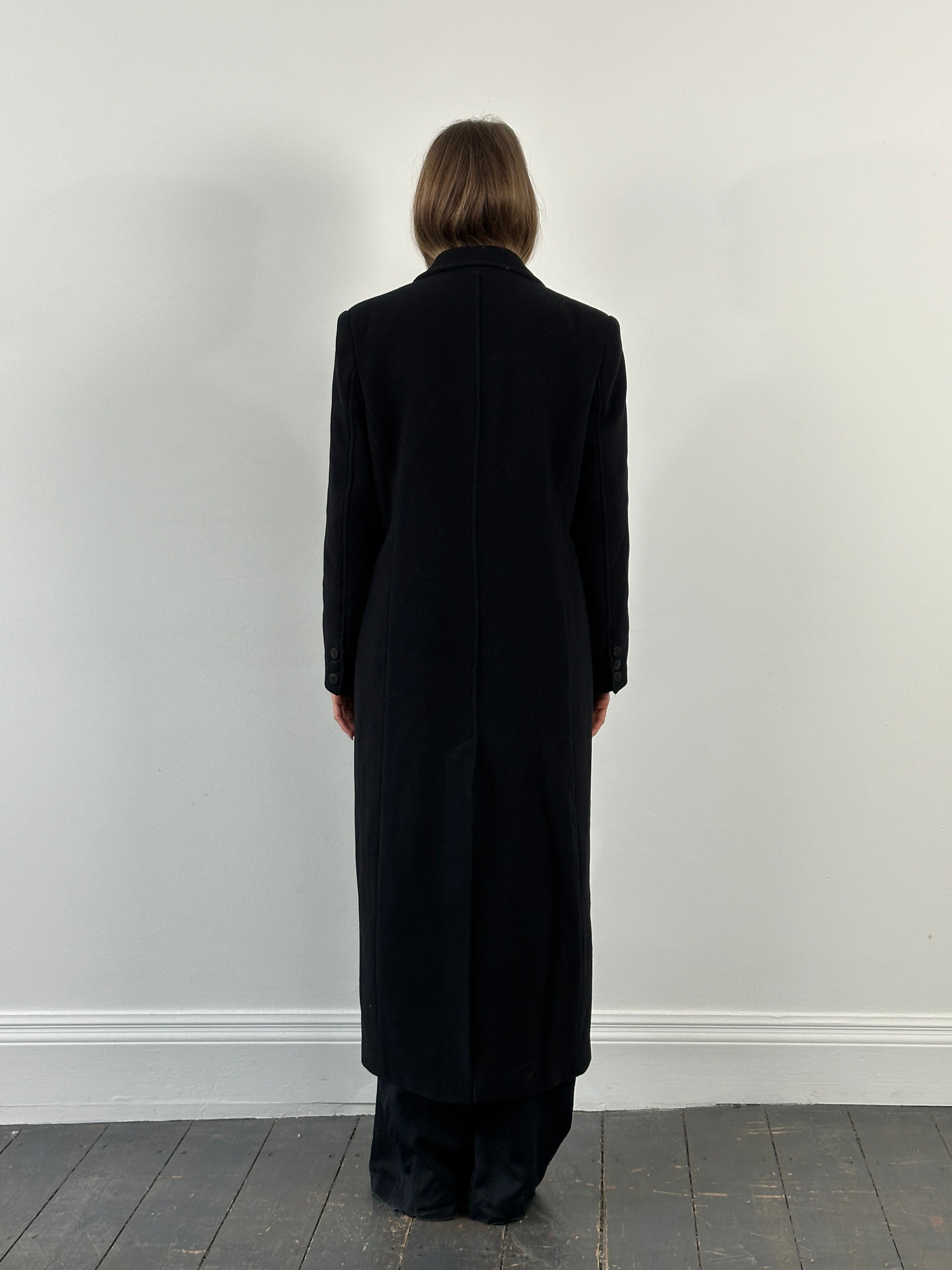 Vintage 1990s wool floor-length coat in black, featuring classic design and long sleeves, perfect for stylish cold-weather wear.
