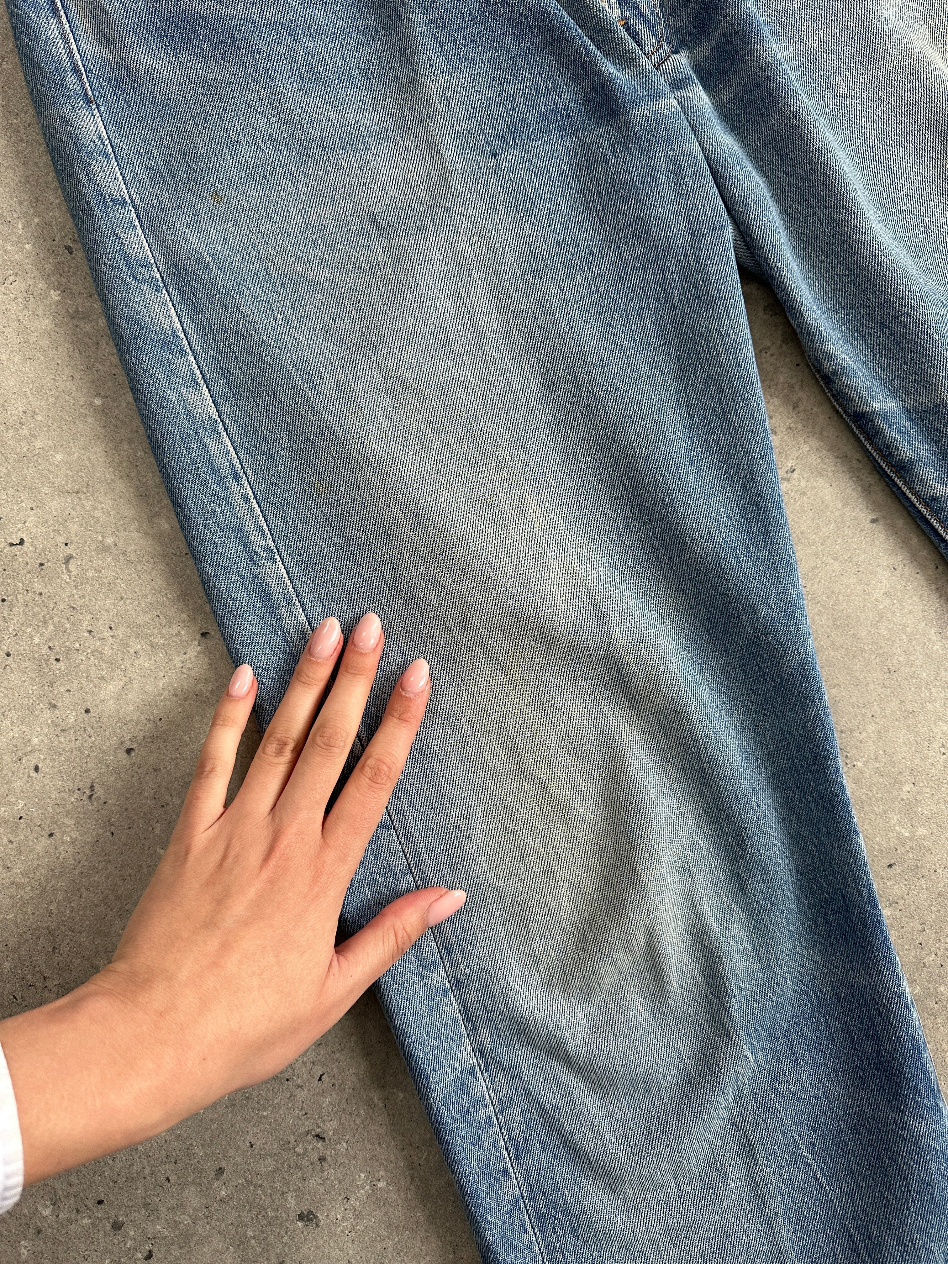 Levi's 501 straight leg denim jeans in W32, showing classic blue denim fabric and traditional button fly.