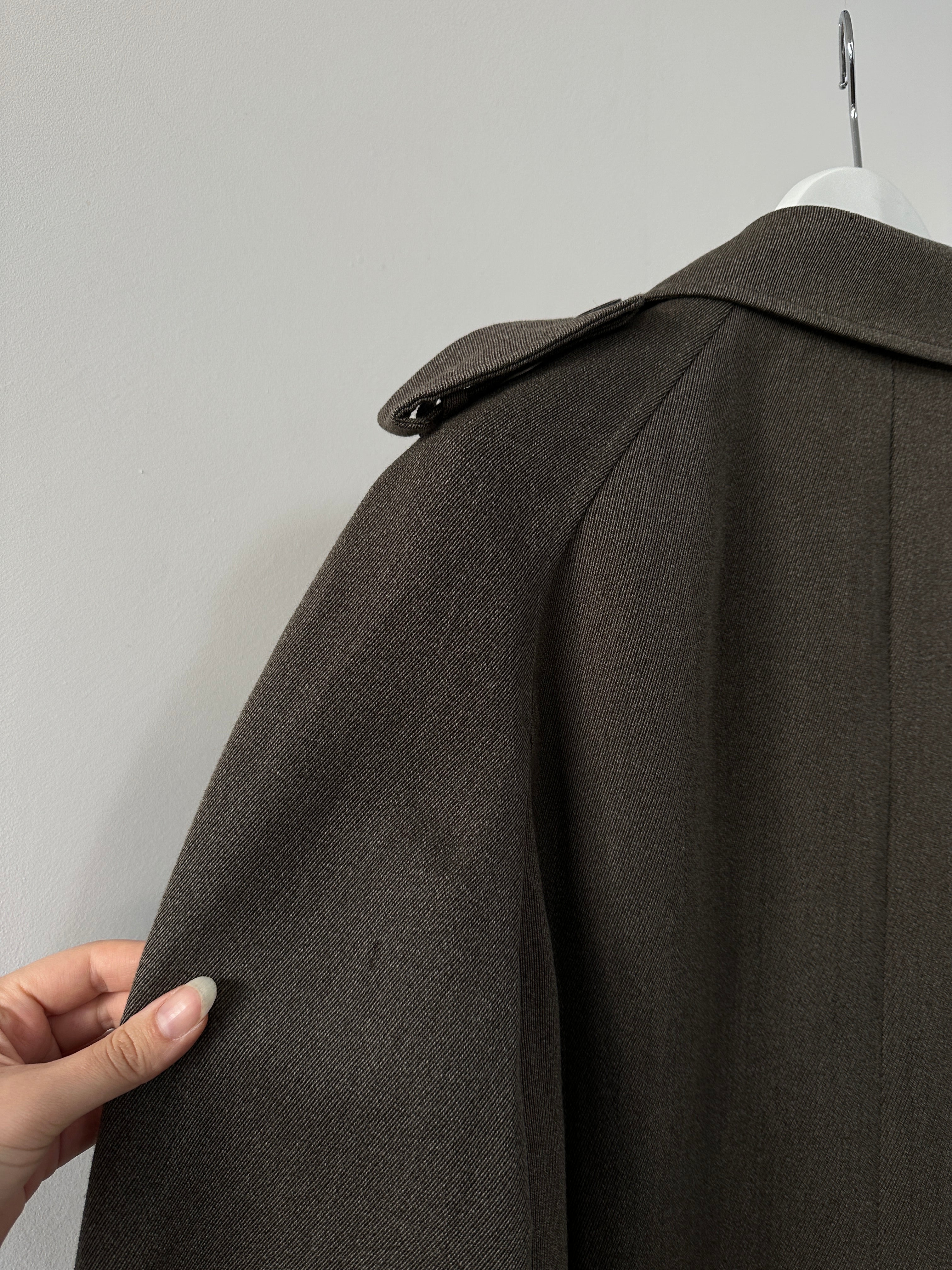 Burberry London wool double-breasted belted trench coat in classic beige, tailored fit, shown on a hanger.