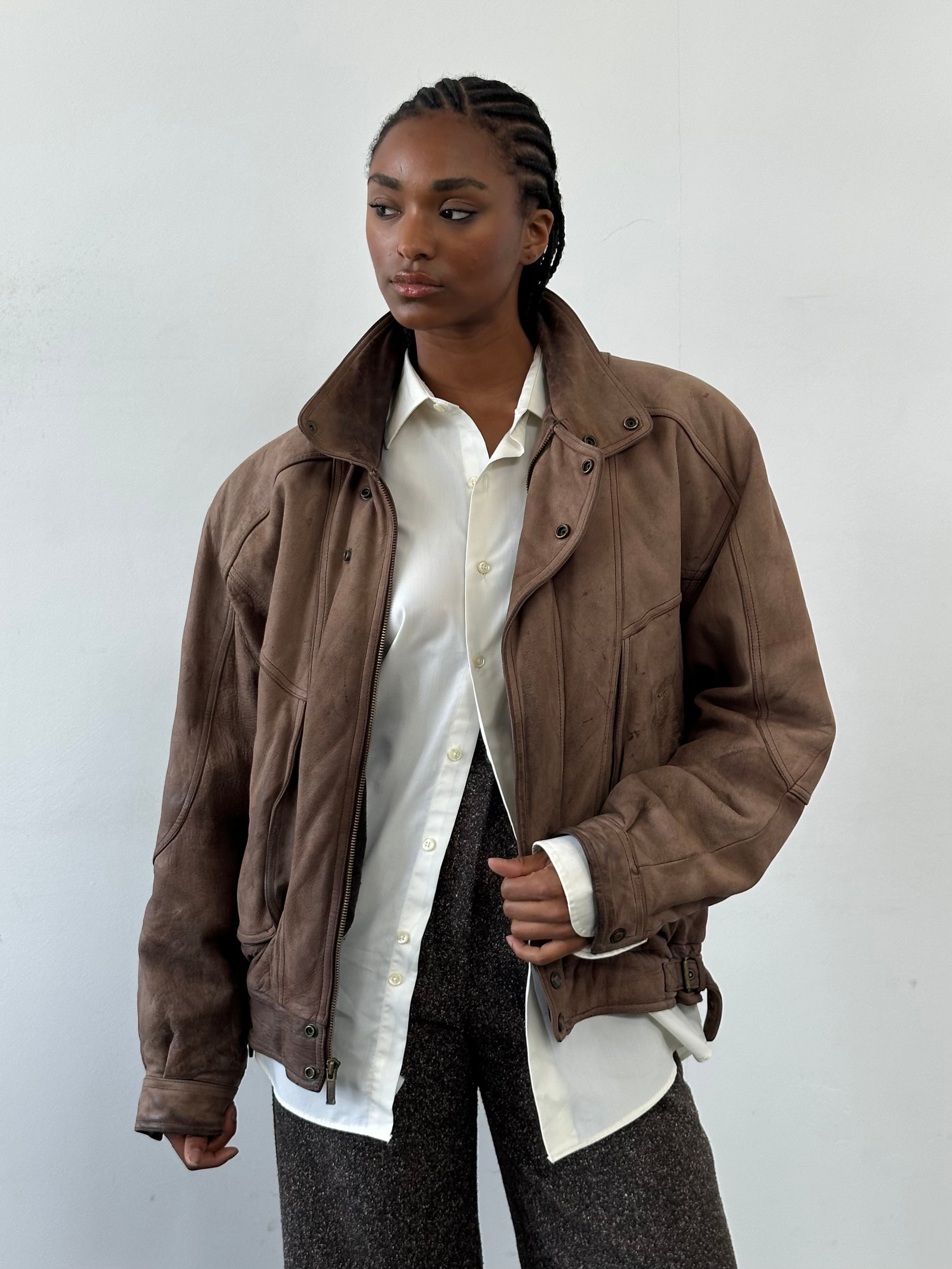 Vintage 1990s high neck aged leather bomber jacket, size large, featuring classic design and distressed leather texture.