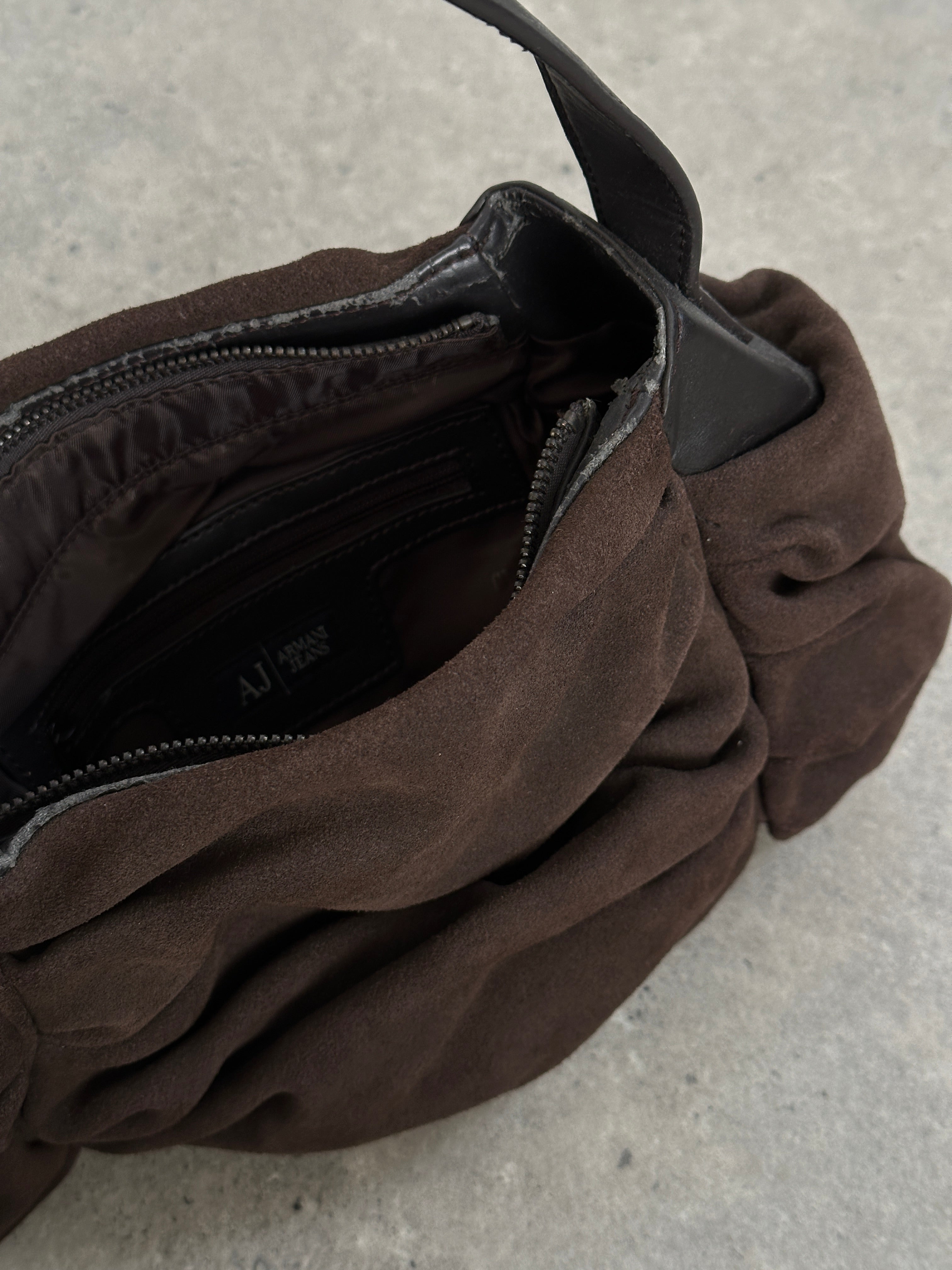 Armani Jeans suede ruched shoulder bag with a sleek design and adjustable strap, stylish for everyday use.