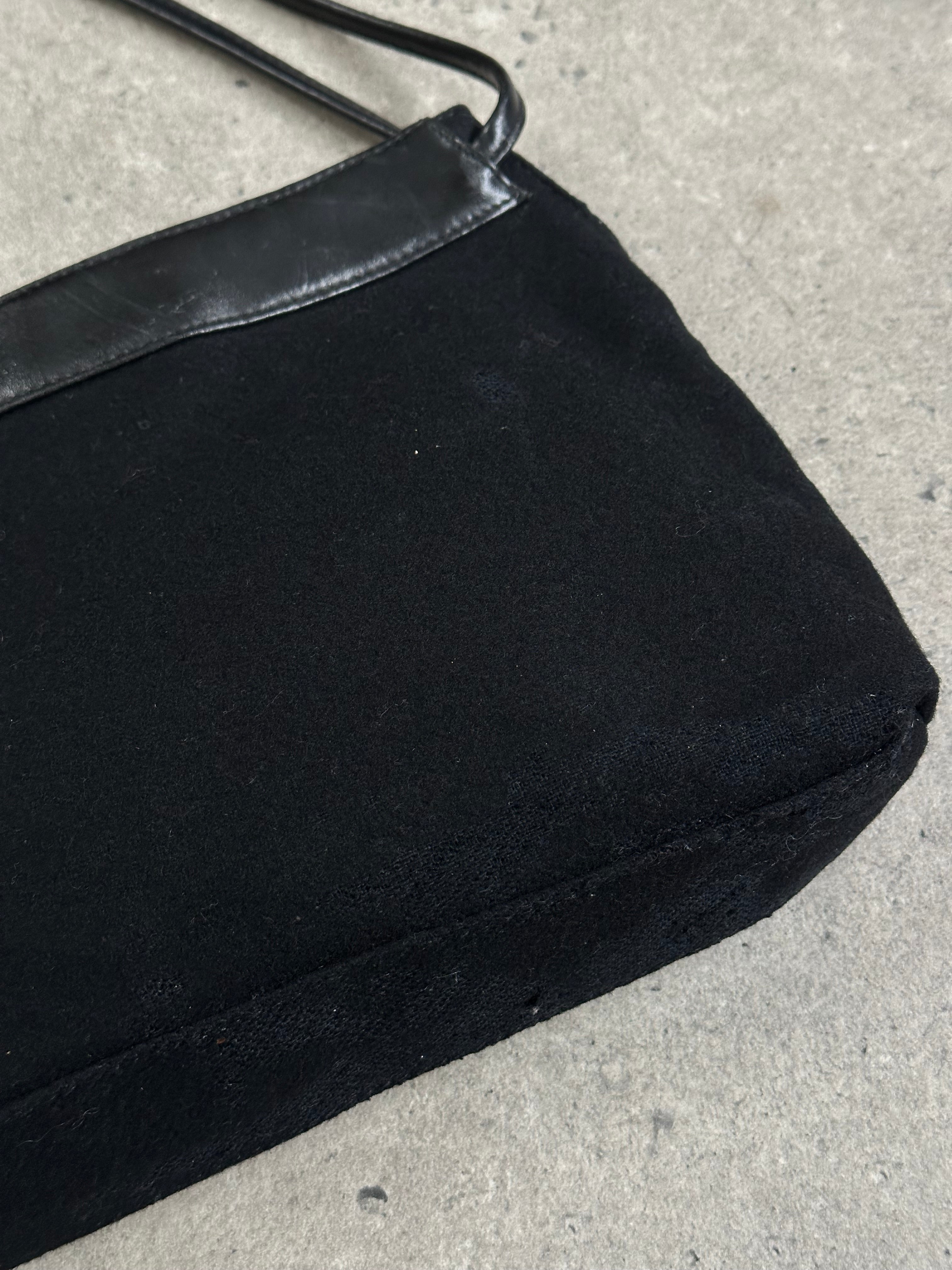 Armani Jeans 2000s wool shoulder bag with a sleek design, featuring a textured wool exterior and a shoulder strap.