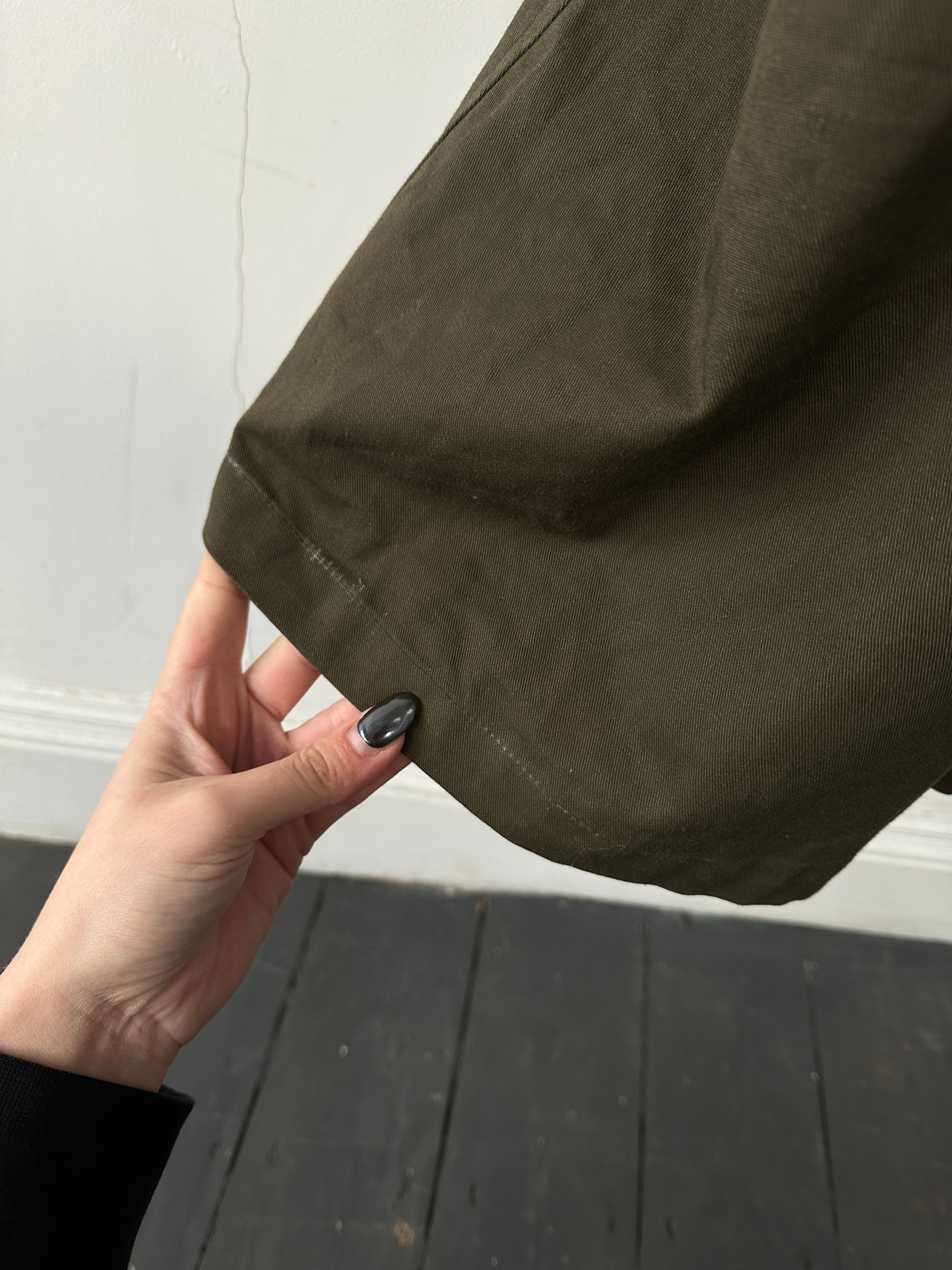 Christian Dior cotton double-breasted trench coat in XL, shown on a hanger with classic design and neutral color.