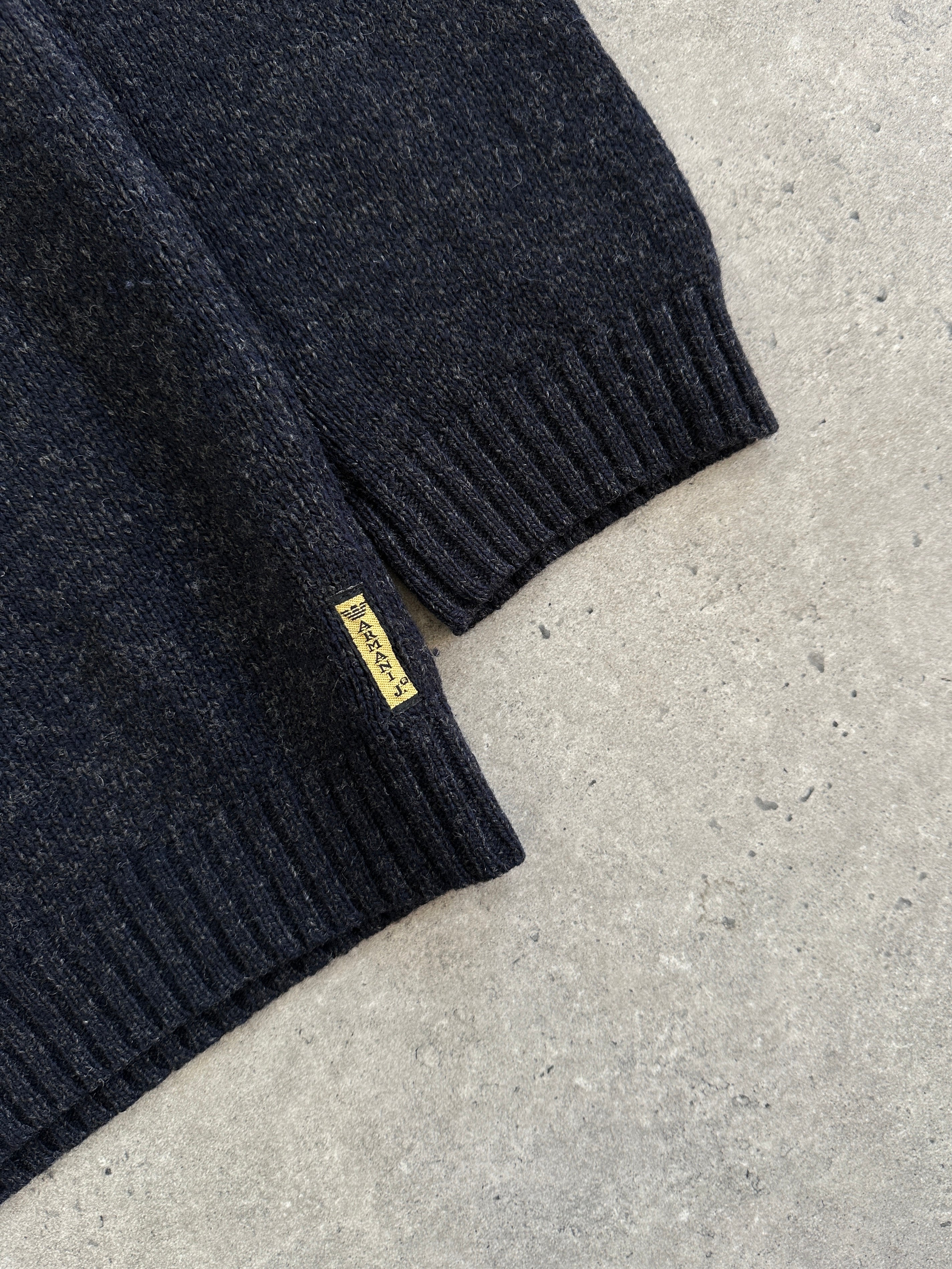 Armani Jeans pure wool roll neck jumper in XL, showcasing a cozy beige knit with a high collar and ribbed cuffs and hem.