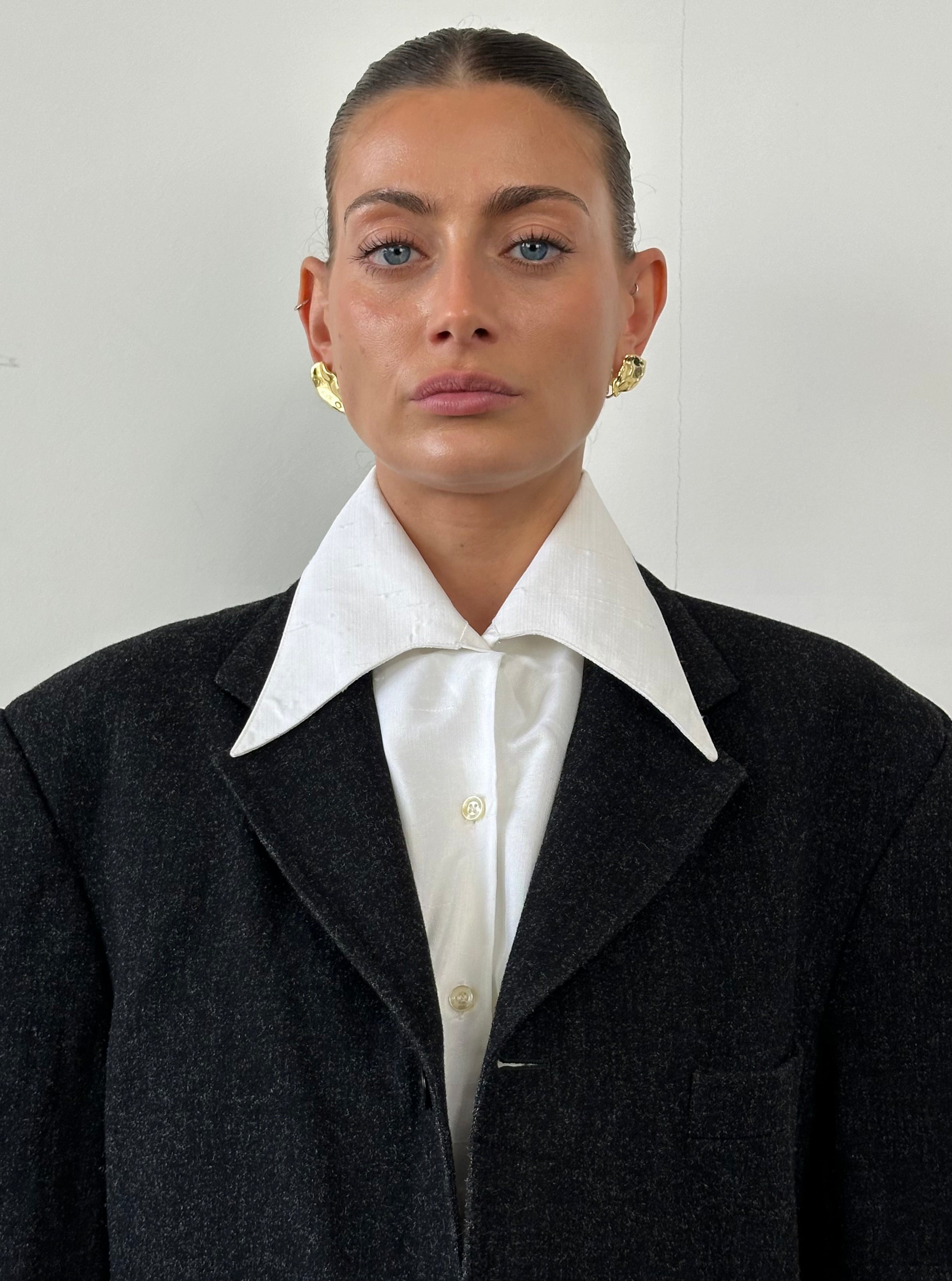 Vintage 1970s dagger collar shirt in size S/M, featuring retro style and classic button-up design with pointed collar.