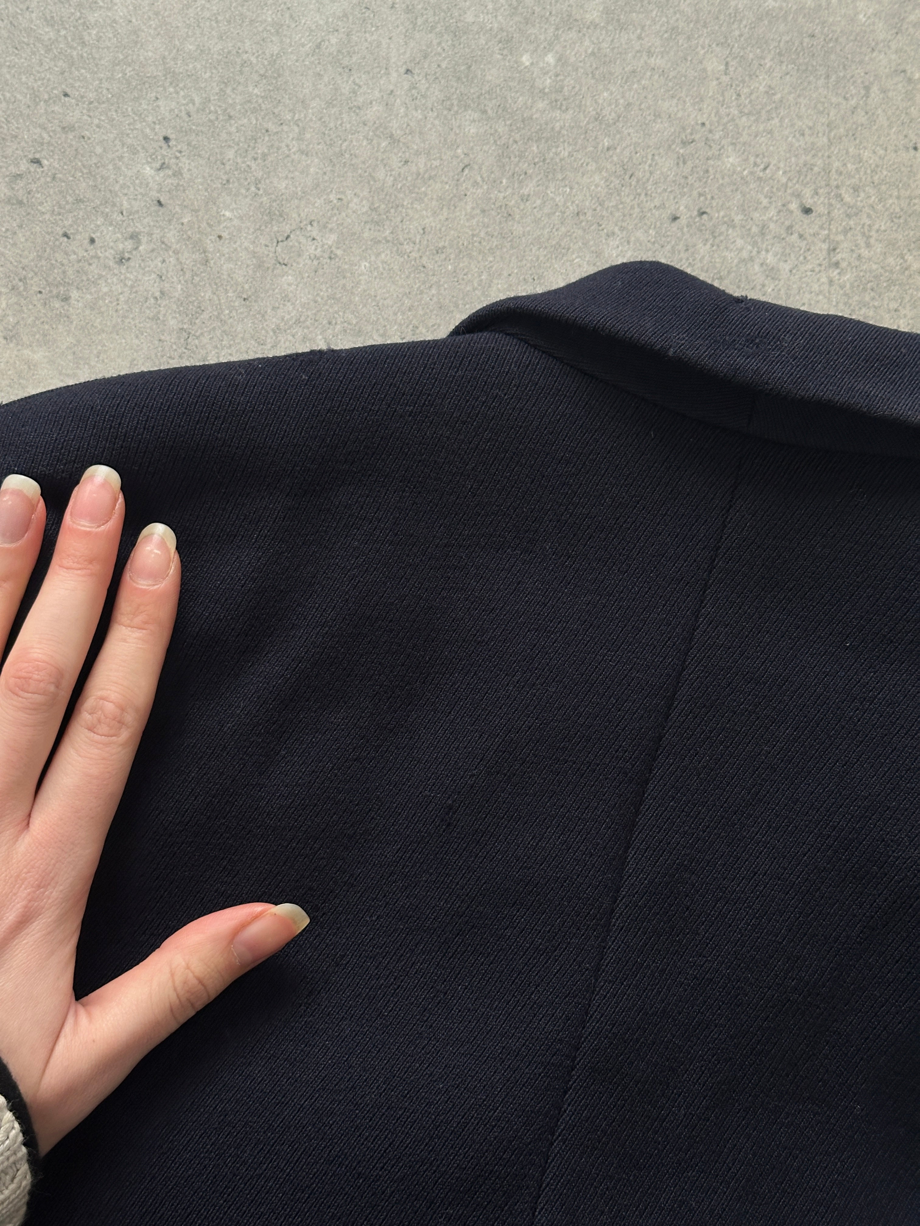 Christian Dior 1980s pure wool double-breasted coat in size S, showing classic tailored design with lapels and button details.