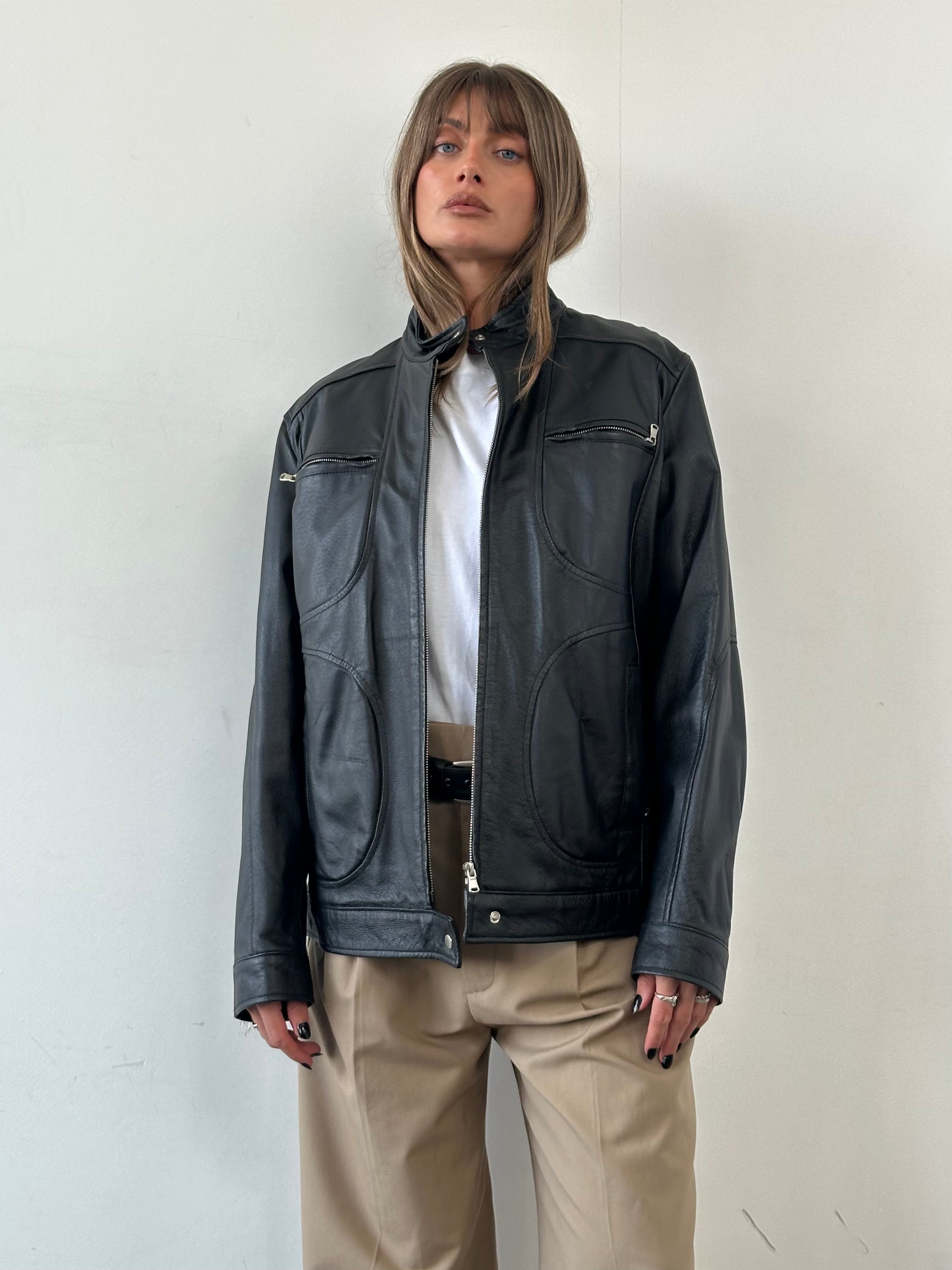 Vintage Moto Leather Jacket in size M/L, featuring classic black leather with silver hardware and a rugged, timeless design.