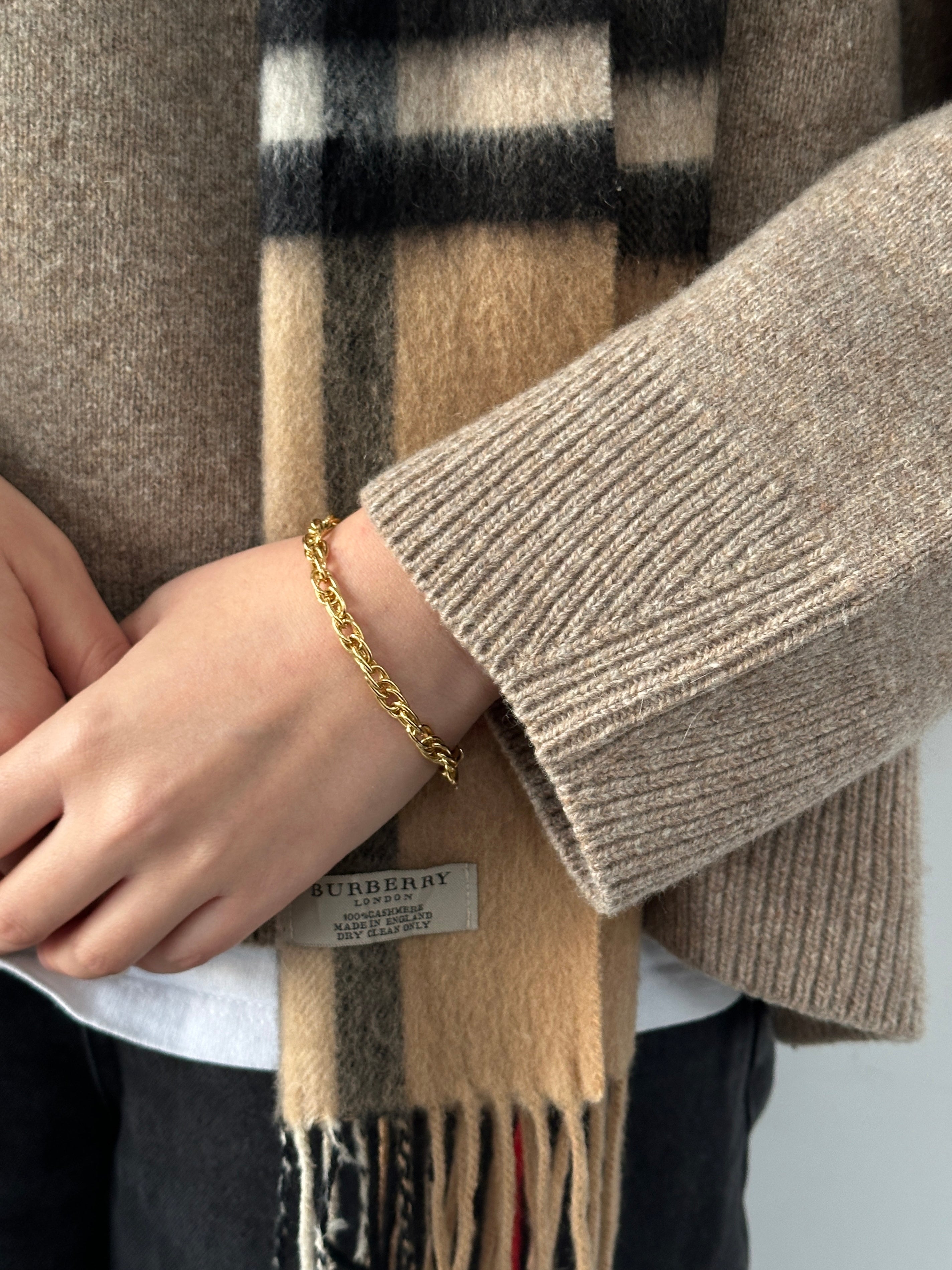 Gold plated Pierre Cardin bracelet with sleek, modern design, featuring smooth links and subtle branding details.