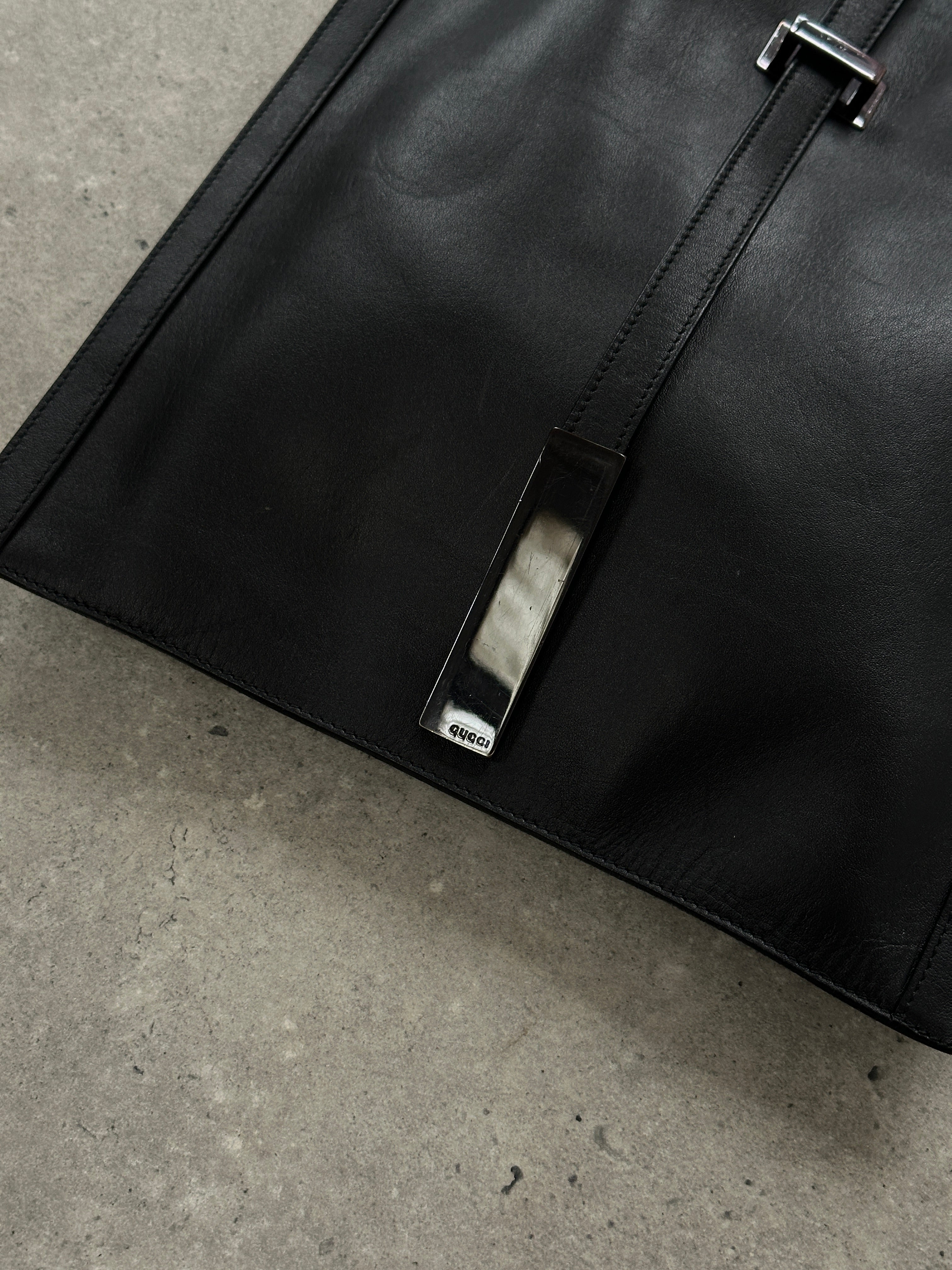 Gucci minimal rectangle leather bag with sleek design, featuring a smooth leather finish and subtle branding.