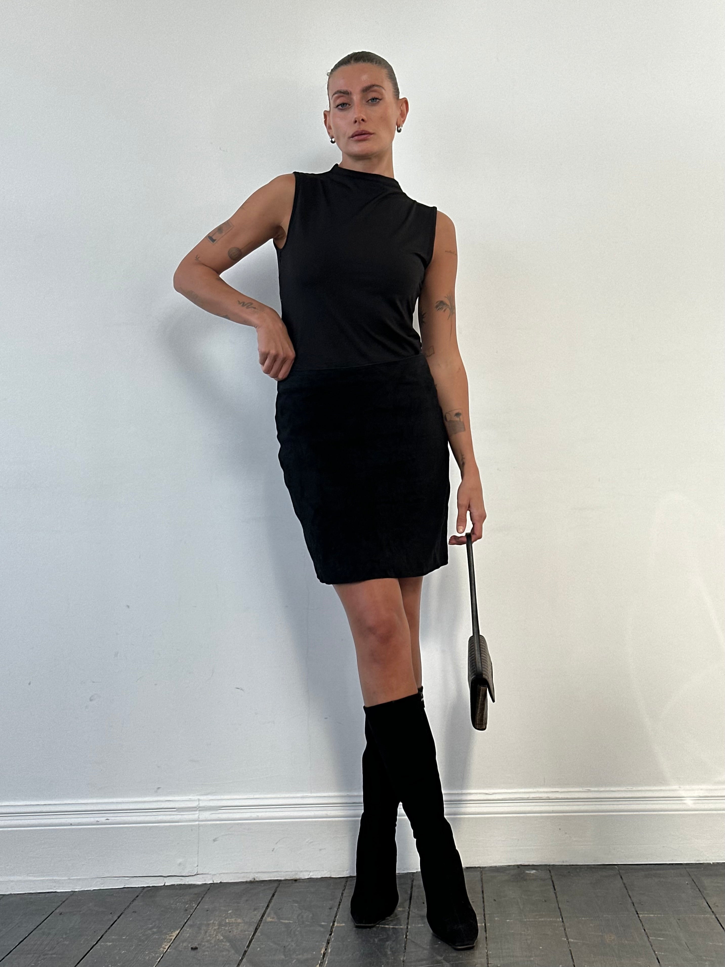 Versace 1990s suede mini skirt in W30 size, shown in a dark rich color with classic 90s design details.