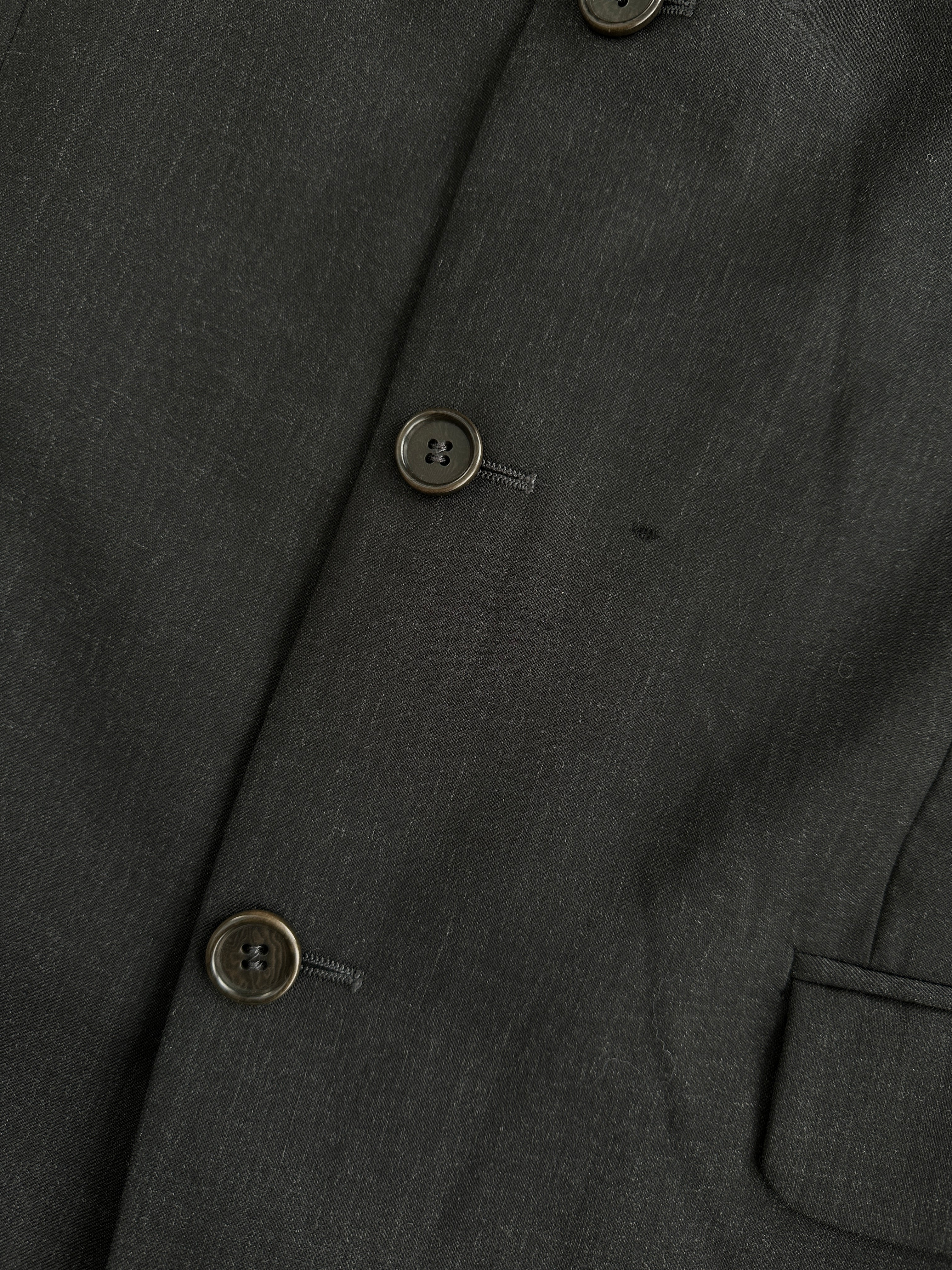 Yves Saint Laurent men's 1990s pure wool single-breasted blazer in size 40R/XL, shown hanging on a wooden hanger.