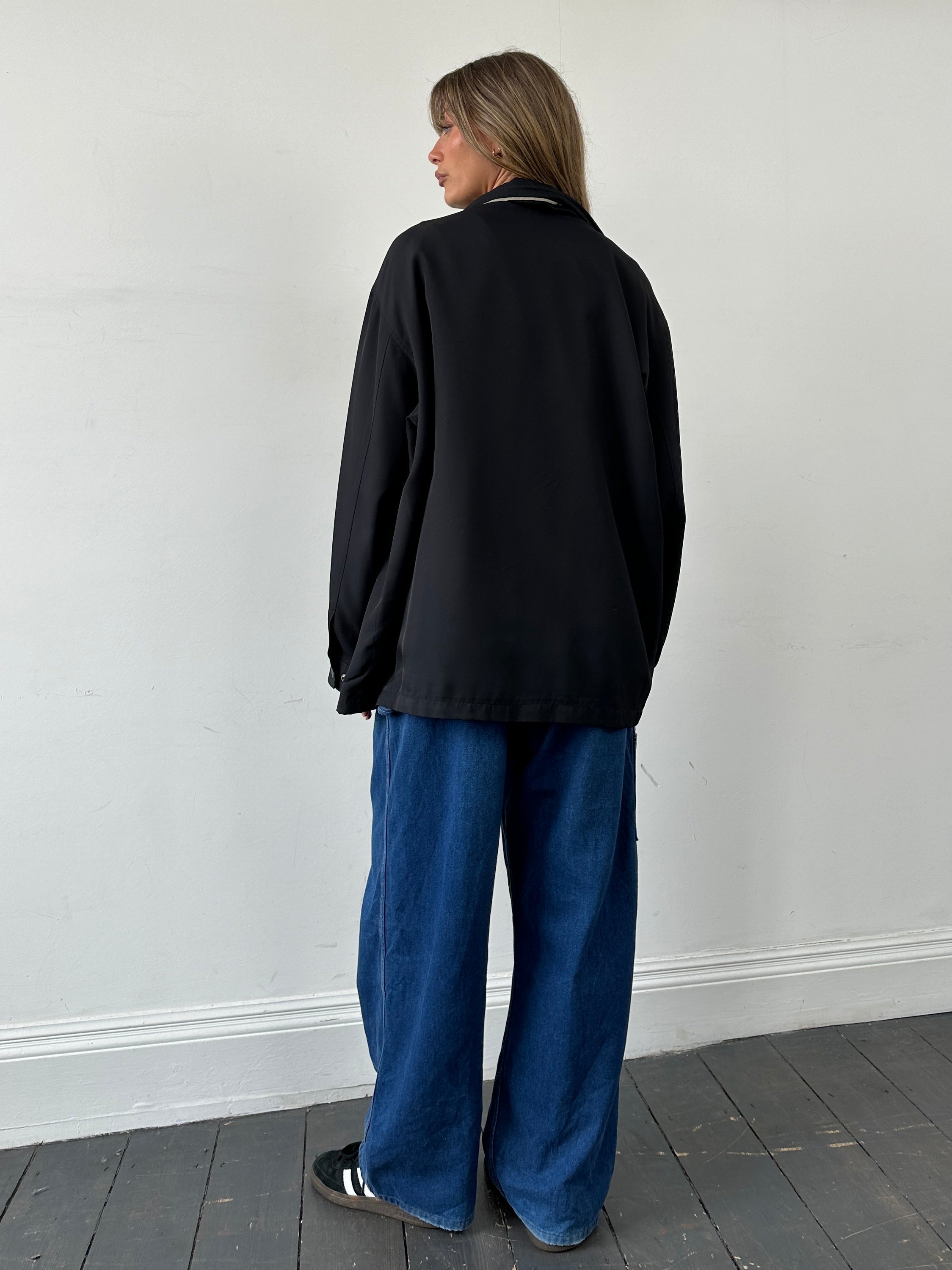 Yves Saint Laurent Pour Homme showerproof logo bomber jacket in XL/XXL, black with YSL branding and ribbed cuffs.