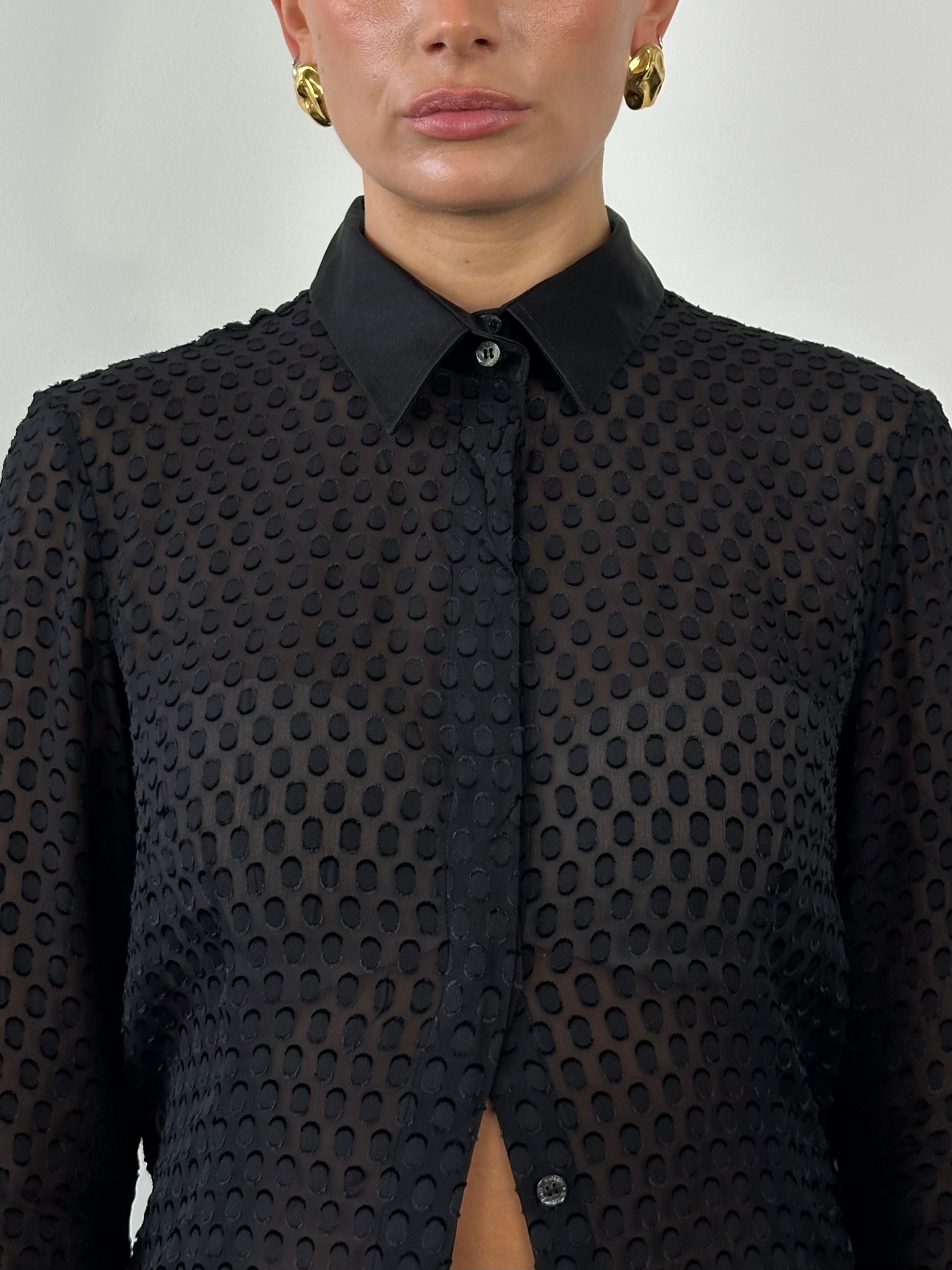 Dolce & Gabbana silk sheer print shirt in size S/M with vibrant floral pattern and classic collar, displayed on a hanger.