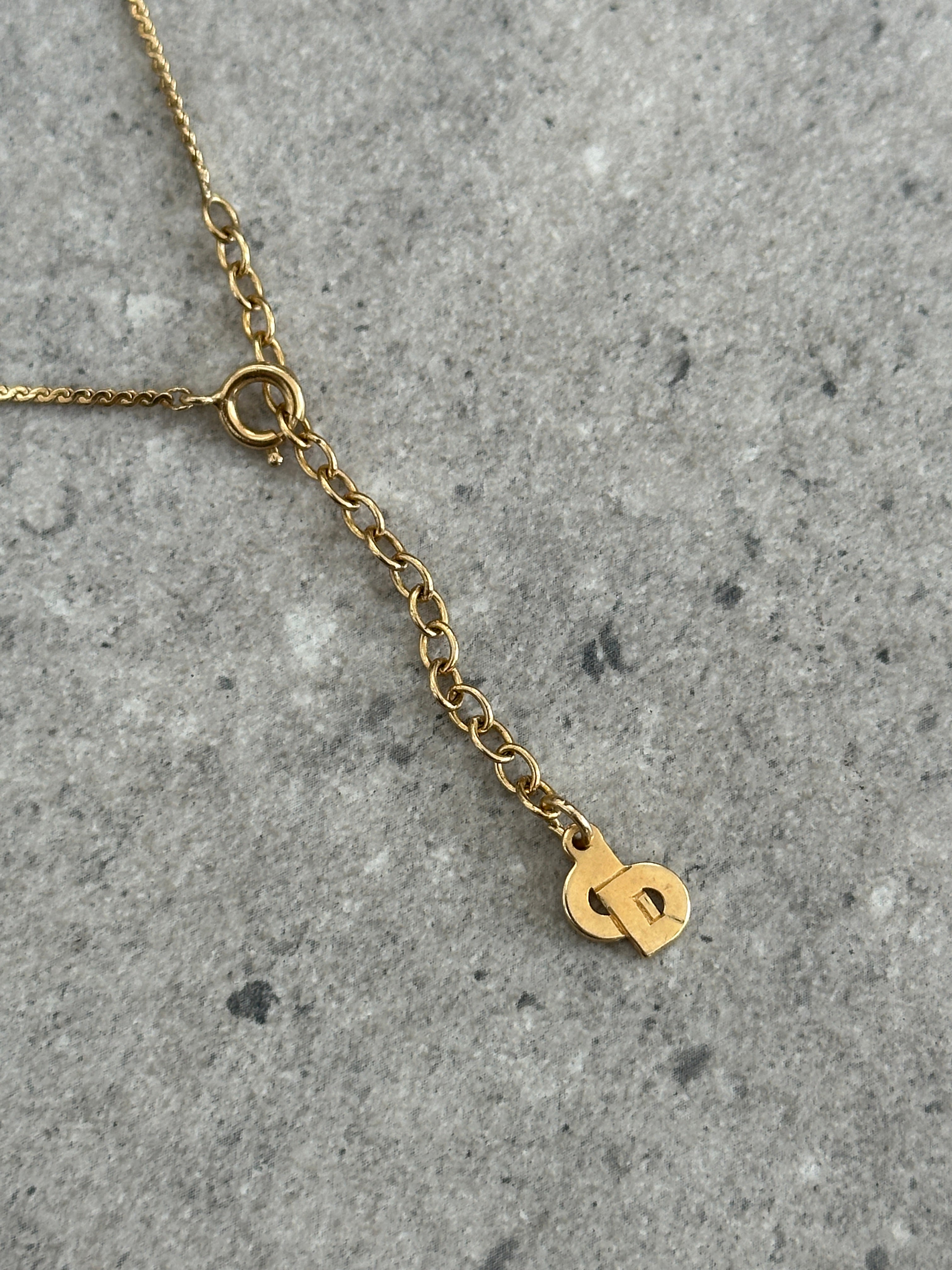 Christian Dior 1990s gold plated CD logo pendant necklace featuring a 16-inch chain and iconic designer charm.