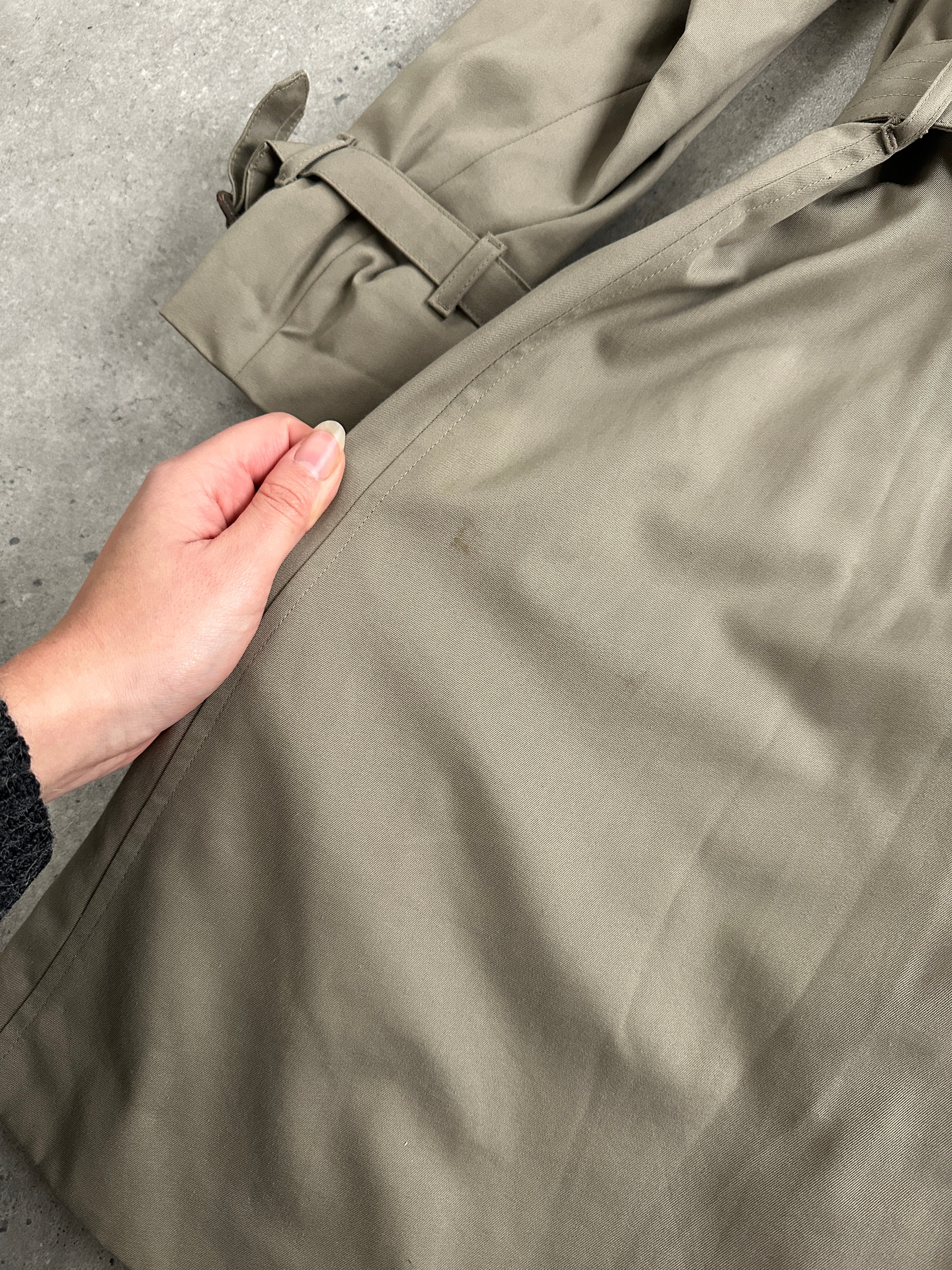 Aquascutum pure cotton double-breasted belted trench coat in XL, shown on a hanger with classic design and neutral color.