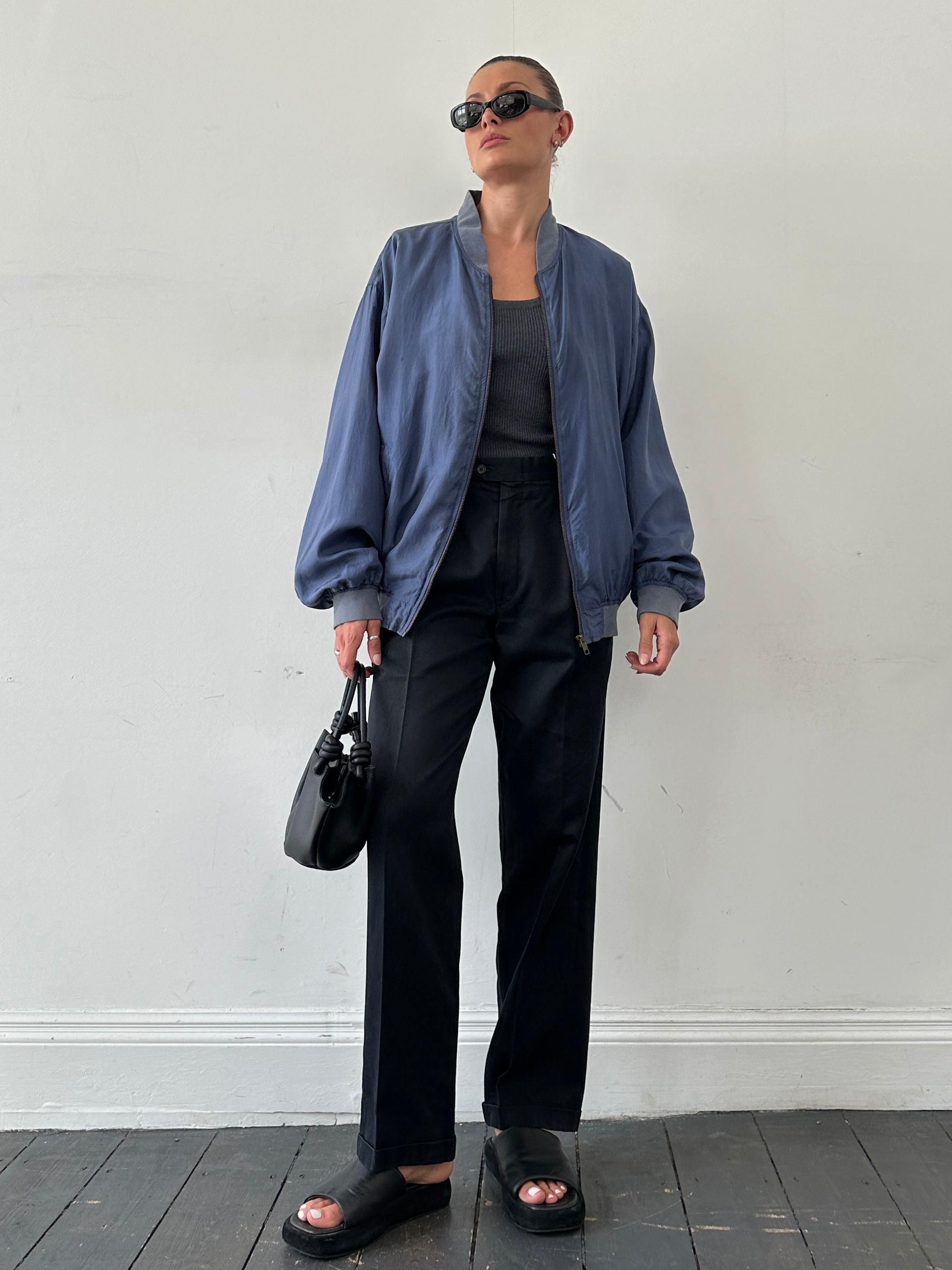 Vintage pure silk bomber jacket in XL size, showcasing a sleek, smooth fabric with a classic design and subtle sheen.